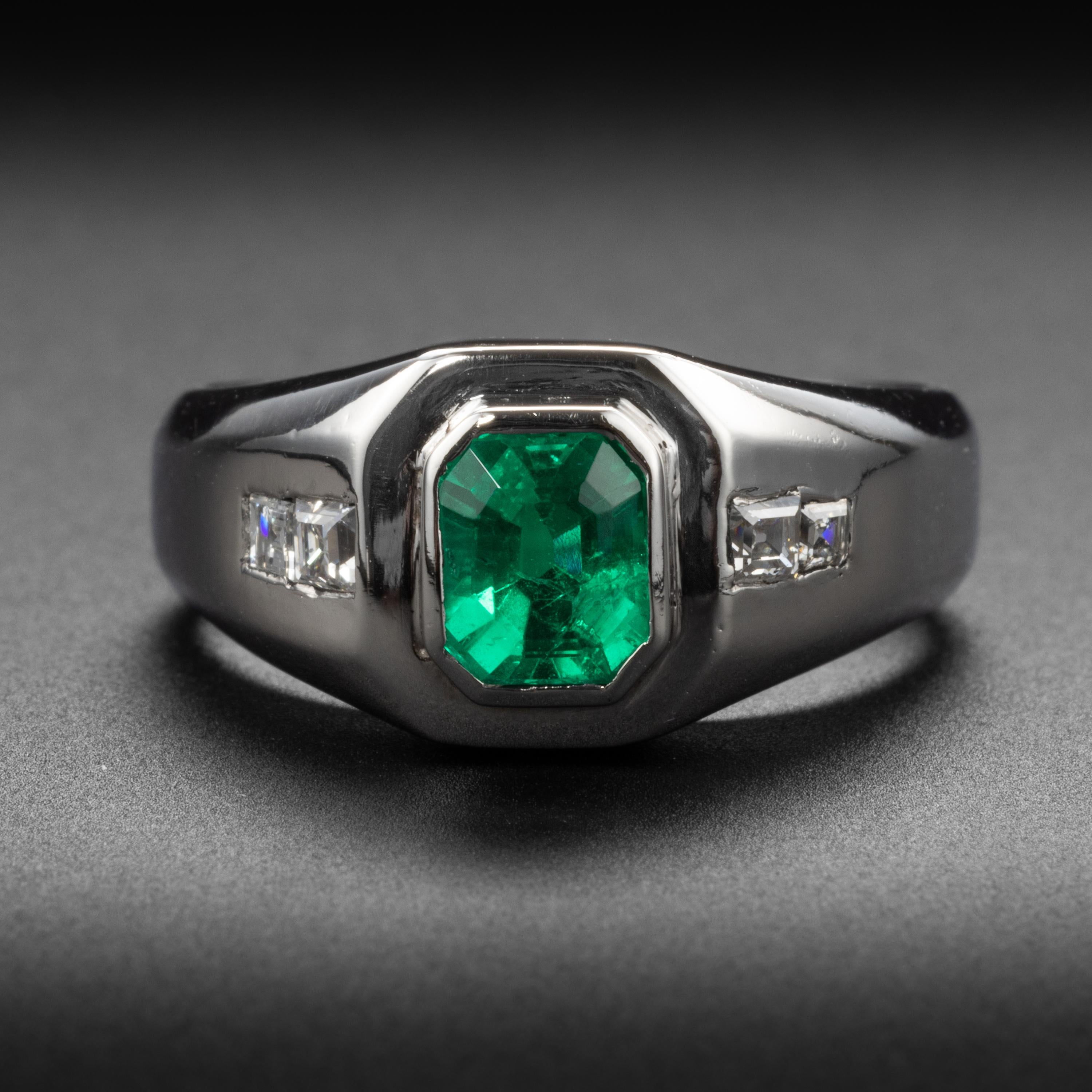 Emerald doesn't come any finer than what you see here in this vintage men's ring. This dense platinum hand-fabricated ring from the mid-1990s features a one-carat emerald-cut emerald of the finest color; a vividly saturated bluish-green that is