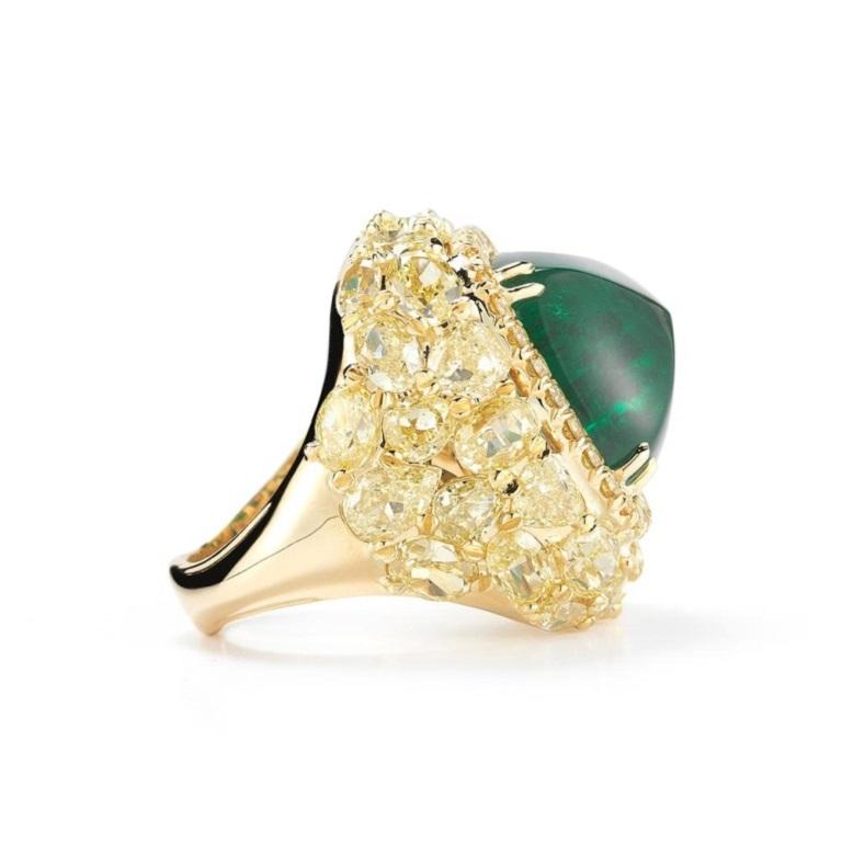 COLOMBIAN EMERALD SUGARLOAF RING A very rare high quality Colombian Emerald sugarloaf is vaulted by a warm setting full of fancy yellow diamonds in various shapes surrounded by yellow gold. Item: # 02649 Metal: 18k Y Lab: Gia Color Weight: 18.82 ct.