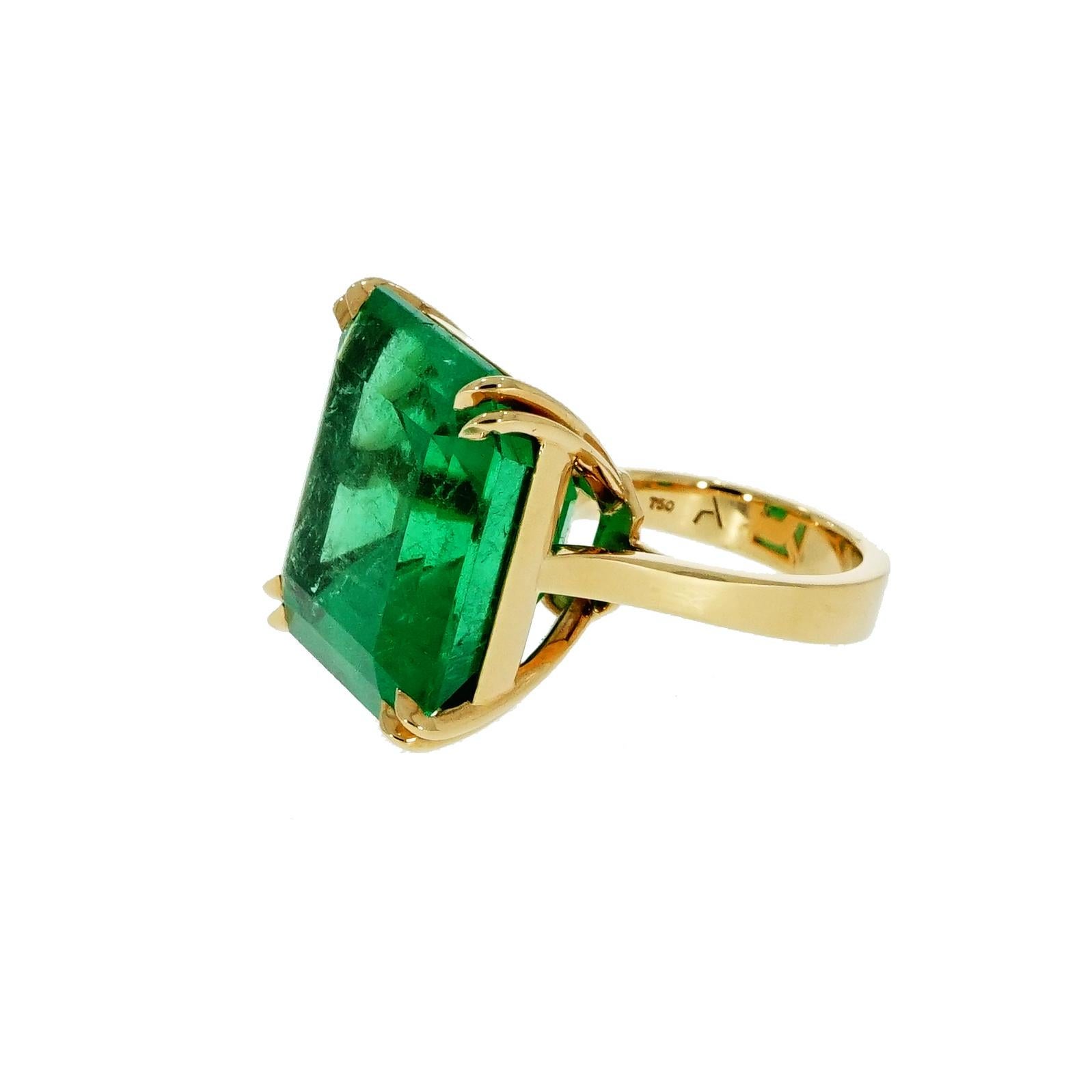 Absolutely gorgeous!!! Squared emerald cut Colombian Emerald Yellow Gold Ring with a nice deep green color in a handcrafted 18k Yellow Gold mounting to fit a 5.75 finger size (can be sized accordingly) 
The emerald weigh is 40.14 carats and measures