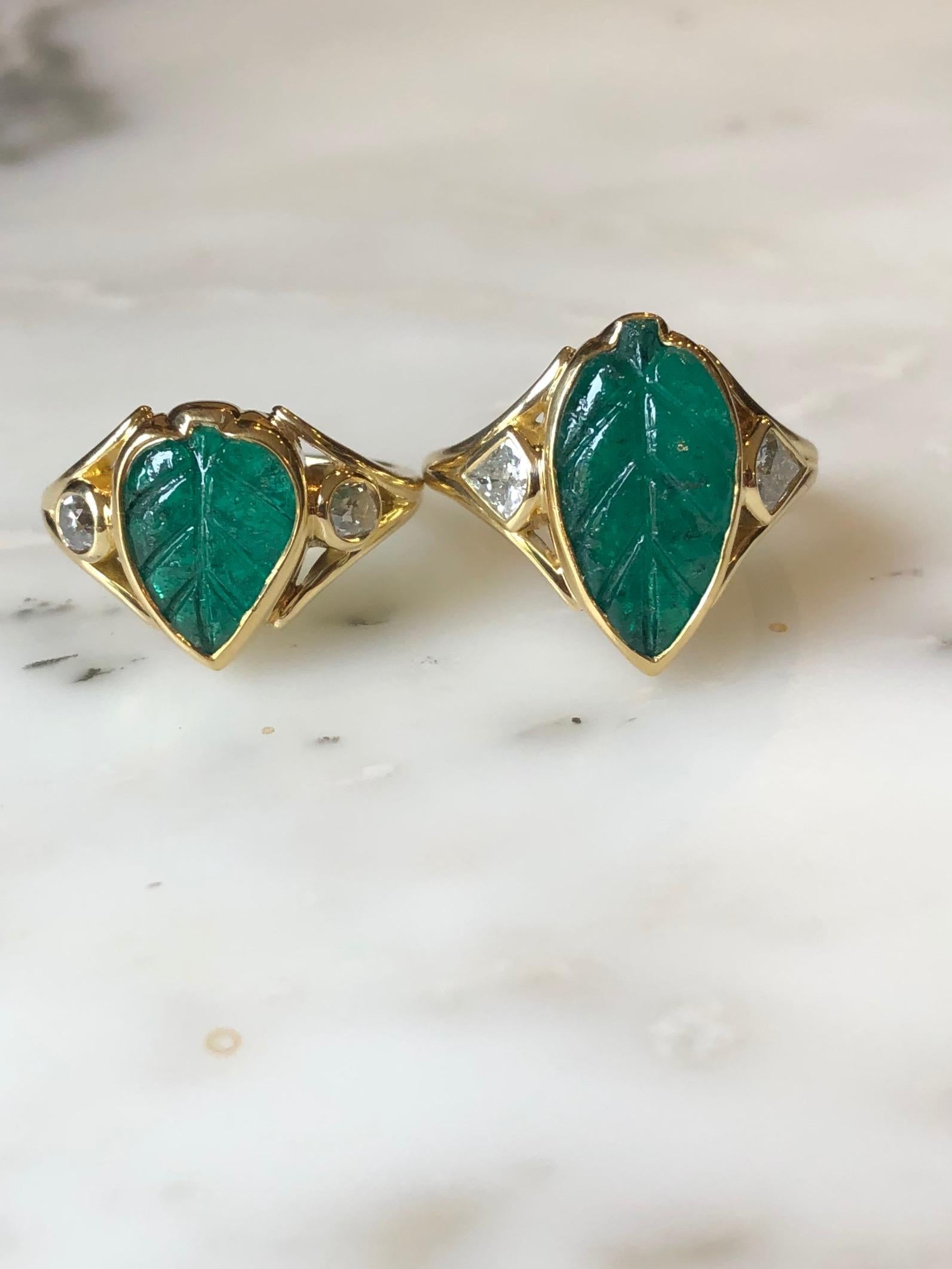 Hand carved Muzo Colombian emerald leaf ring with VS+ diamonds flanking. This emerald was sourced directly from Colombia through our collaboration with IEEX Emeralds. This ring is made by hand using ancient gold-smithing techniques in California by
