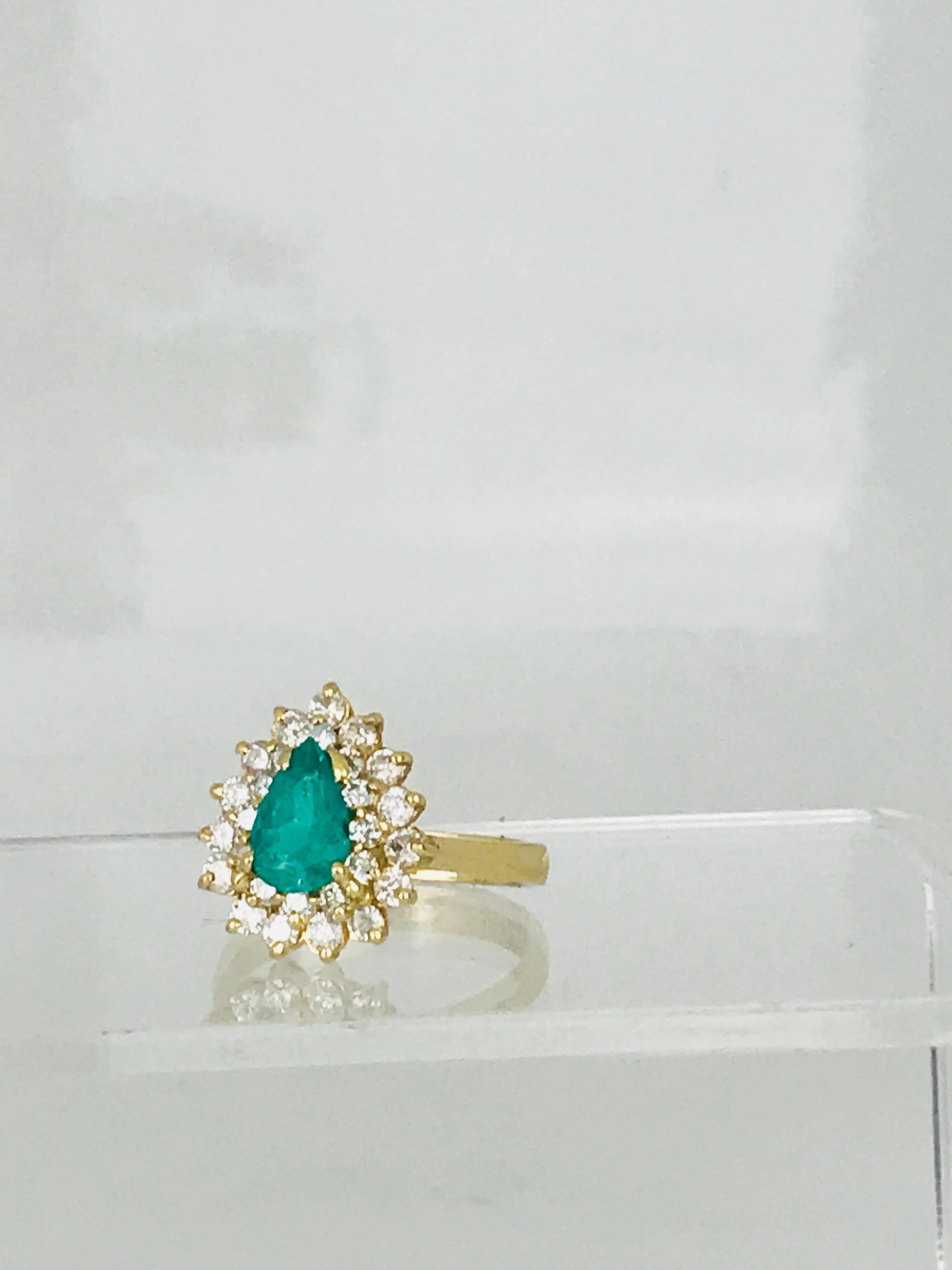14 karat emerald and diamond cocktail ring. The center emerald is a Colombian origin and measures 5.77-9.02 x 4.00 in diameter. The weight of the emerald is 1.25 carat, approximately.
The accenting (27) round diamonds have a total weight of