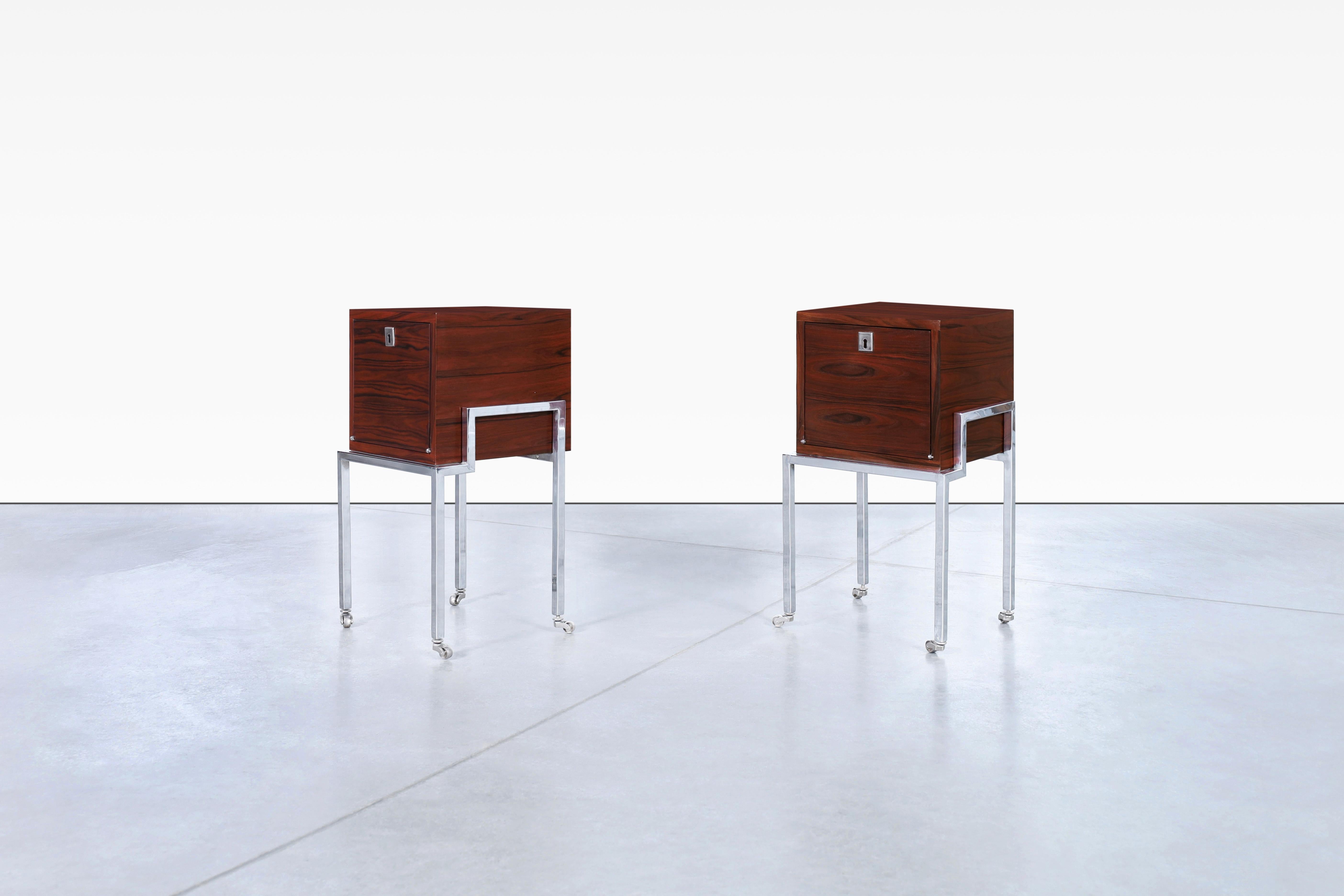 Vintage Colombian rosewood and chrome end tables/nightstands, designed by IMA S.A. in Colombia, circa 1980s. What makes these refinished nightstands truly exceptional is their versatility. With the addition of sturdy steel casters, these pieces can