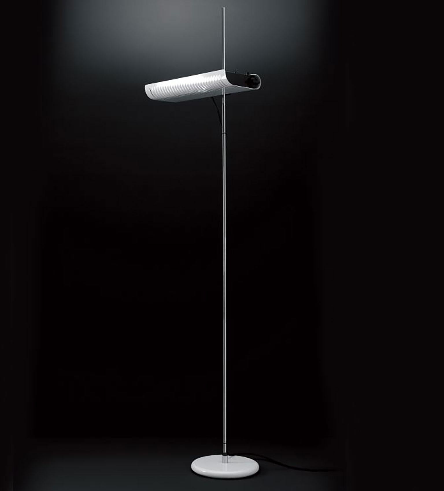 Colombo floor lamp by Joe Colombo for Oluce. This lamp gets its name from the designer who was one of Italy's most iconic designers. The design of this lamp embraces a minimalistic look and was the first household lamp to use halogen bulbs. The