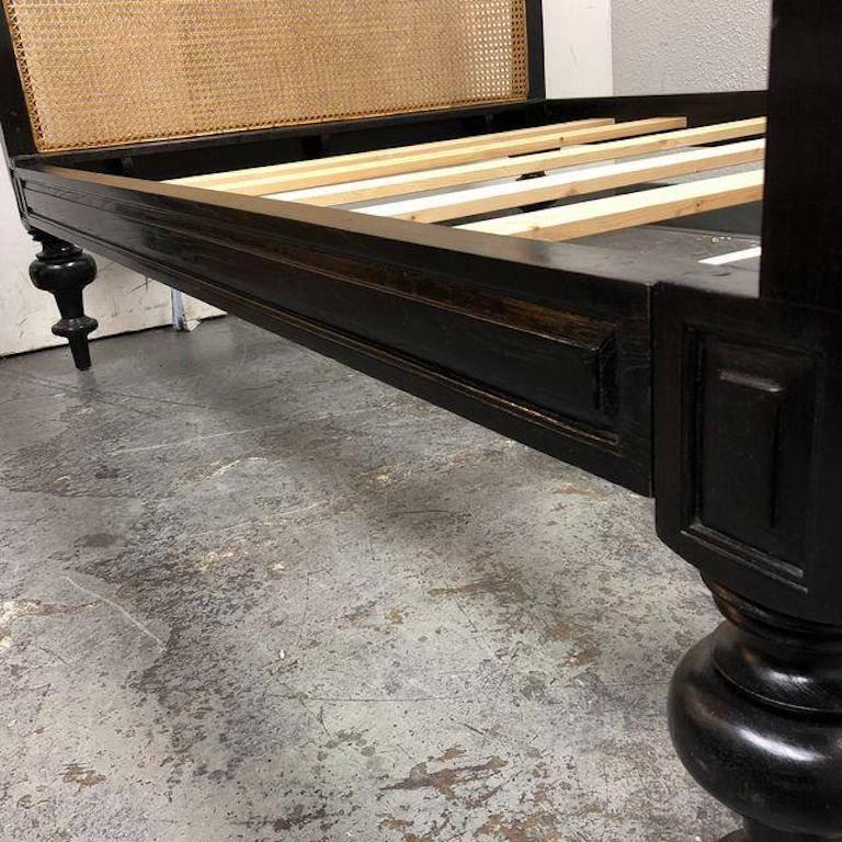 A classic Colonial style sleigh bed, double. Featuring a caned headboard and foot board plus beautifully turned legs in ebonized teak. Slates are included. Height of the platform 16” H. Original. Price: $7,398.00.

 
