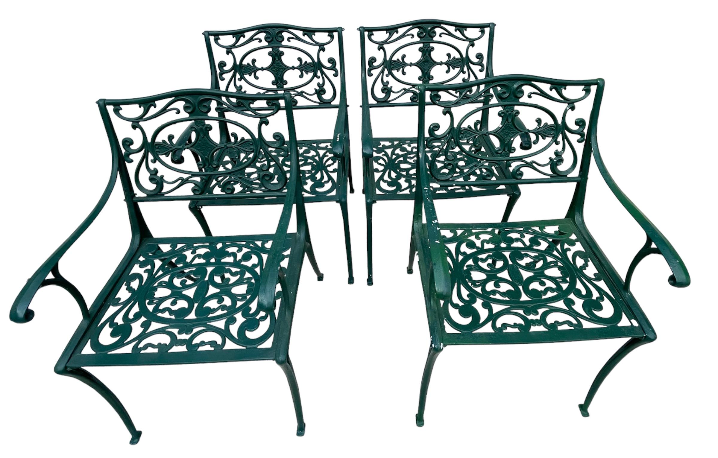 Colonial Casting 5 piece set, table and 4 arm chairs in a hunter green. Solid and not to heavy in weight for easy entertaining.  
32.5 W x 28H Table
20Dx 20Wx 21H Arm chairs
More items available from this collection
