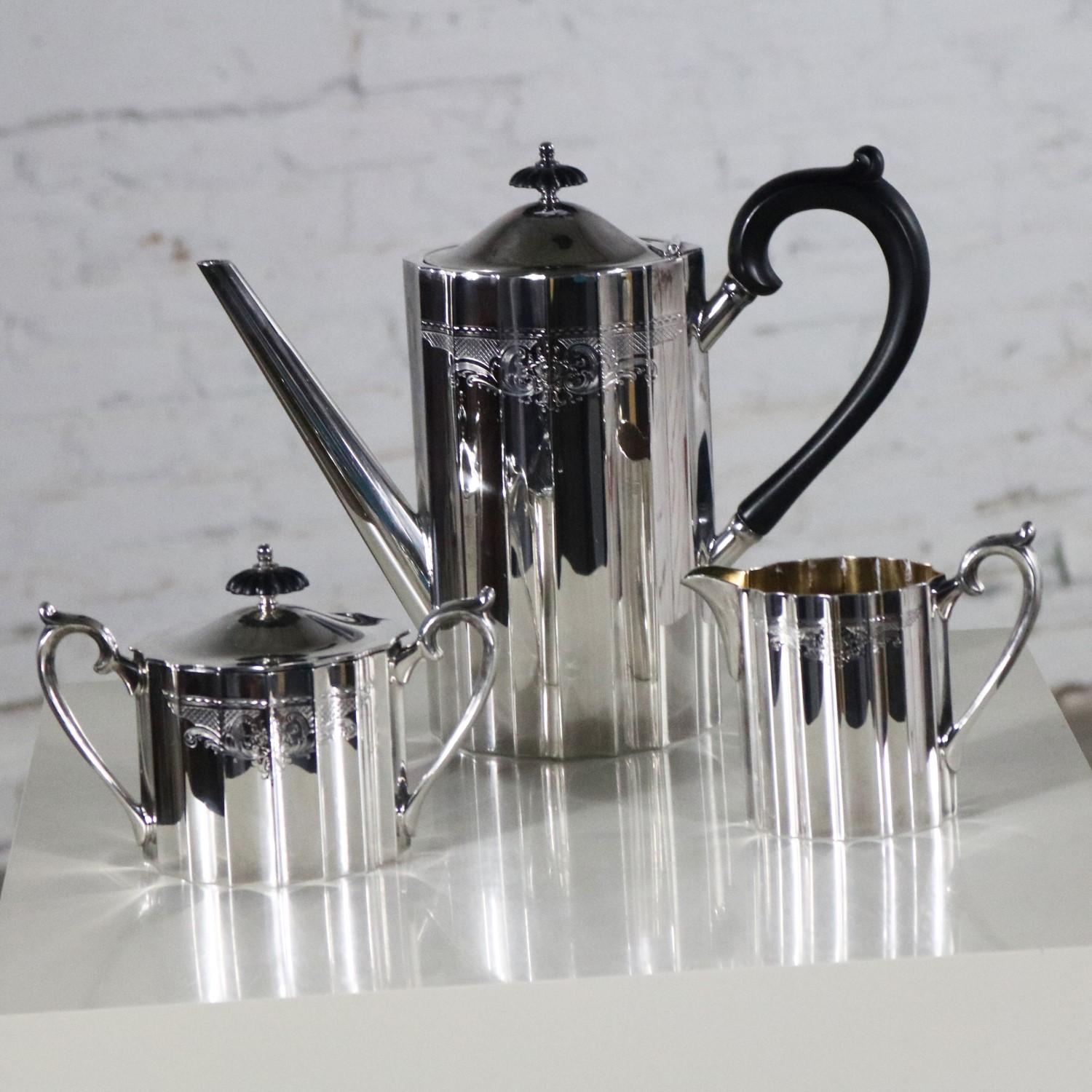 Handsome Colonial Classic silver plate coffee service made by Lunt Silver. This three-piece set includes the coffee pot, creamer, and sugar bowl. It is in fabulous vintage condition, circa 1960s.

Breakfast in bed anyone!!? Serve your morning