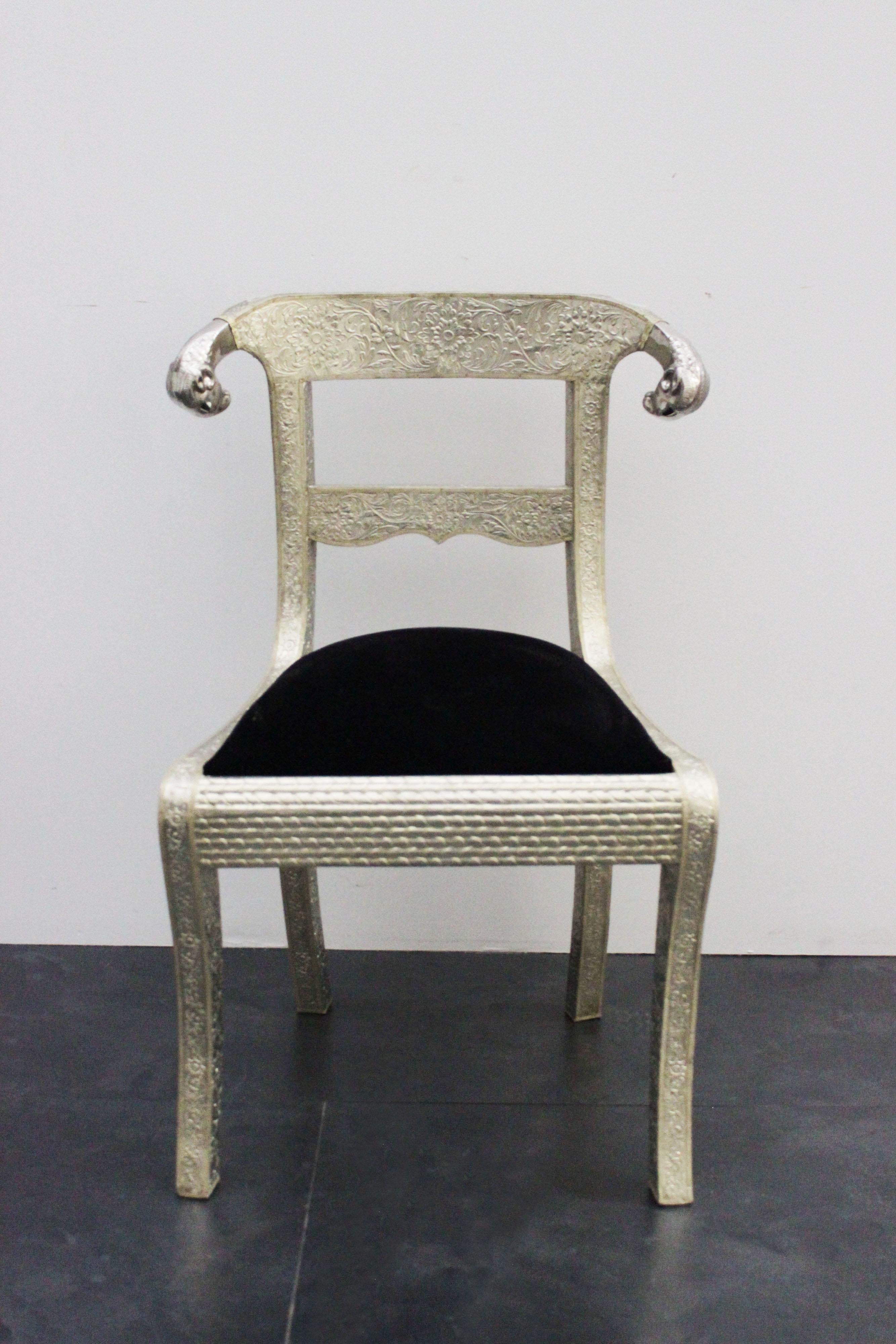 Anglo-Indian colonial dining chairs with structure upholstered in silver-plated metal, with backrest complete with steel ram-shaped zoomorphic heads and velvet seats in various colors. Available - 6 chairs.