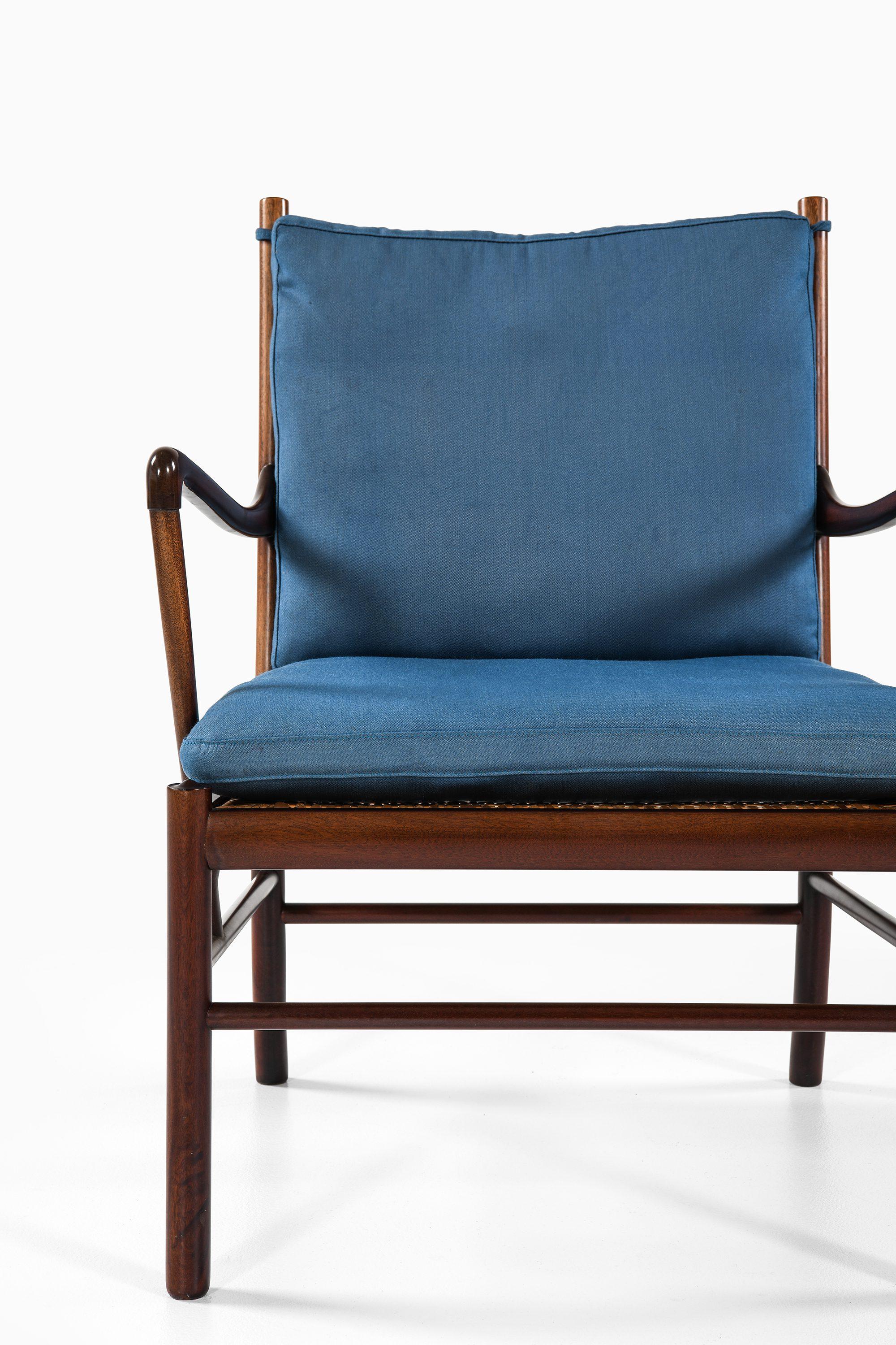 Colonial Easy Chairs in Mahogany, Woven Cane and Fabric by Ole Wanscher, 1960's In Good Condition For Sale In Limhamn, Skåne län