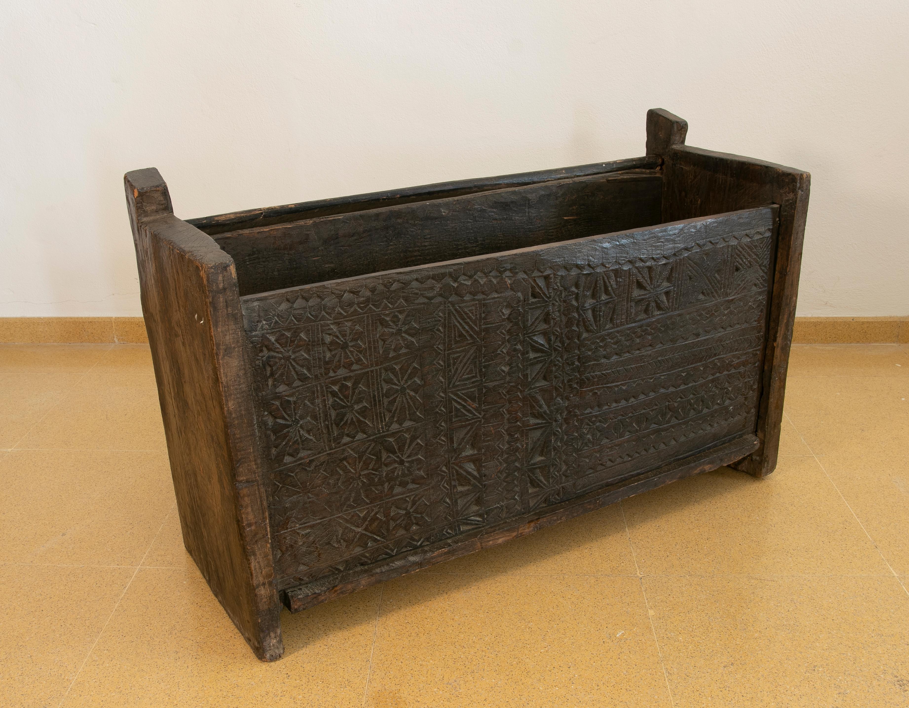 Colonial Hand-Carved wooden box with lid on top.