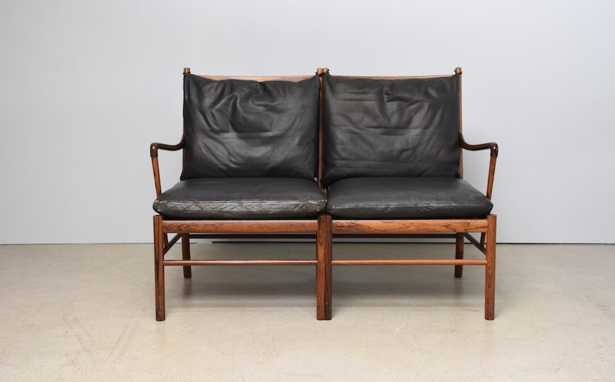 `Colonial` PJ149 sofa and armchair by Ole Wanscher for Jeplpesens Møbelfabrik, Denmark 1960s. Very elegant design from 1959, produced in the 1960s by Poul Jeppesens Møbelfabrik (DK). Frame in rosewood. Original cushions in black leather with