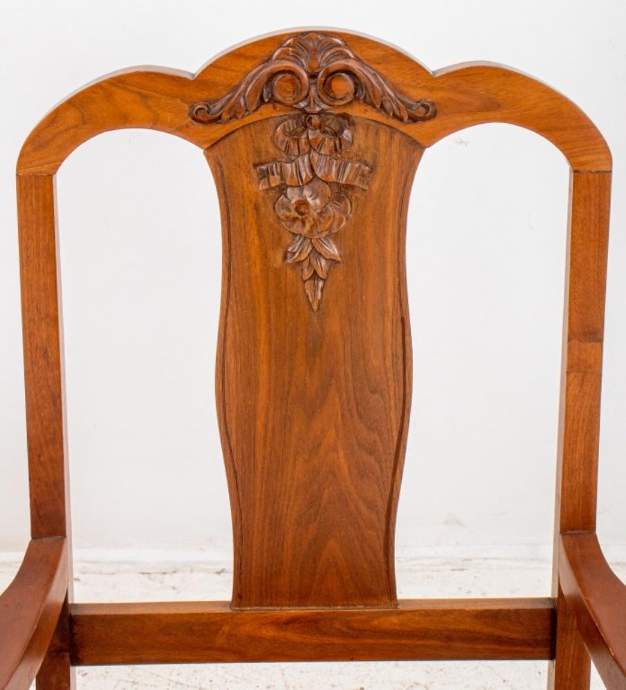 Colonial Revival dining chairs, 8, and comprising six sides and two arm chairs, with arched crest ail and acanthus-applied back splat above shaped square seat on turned fluted legs, the seats with needlepoint covers. Three chairs have loose