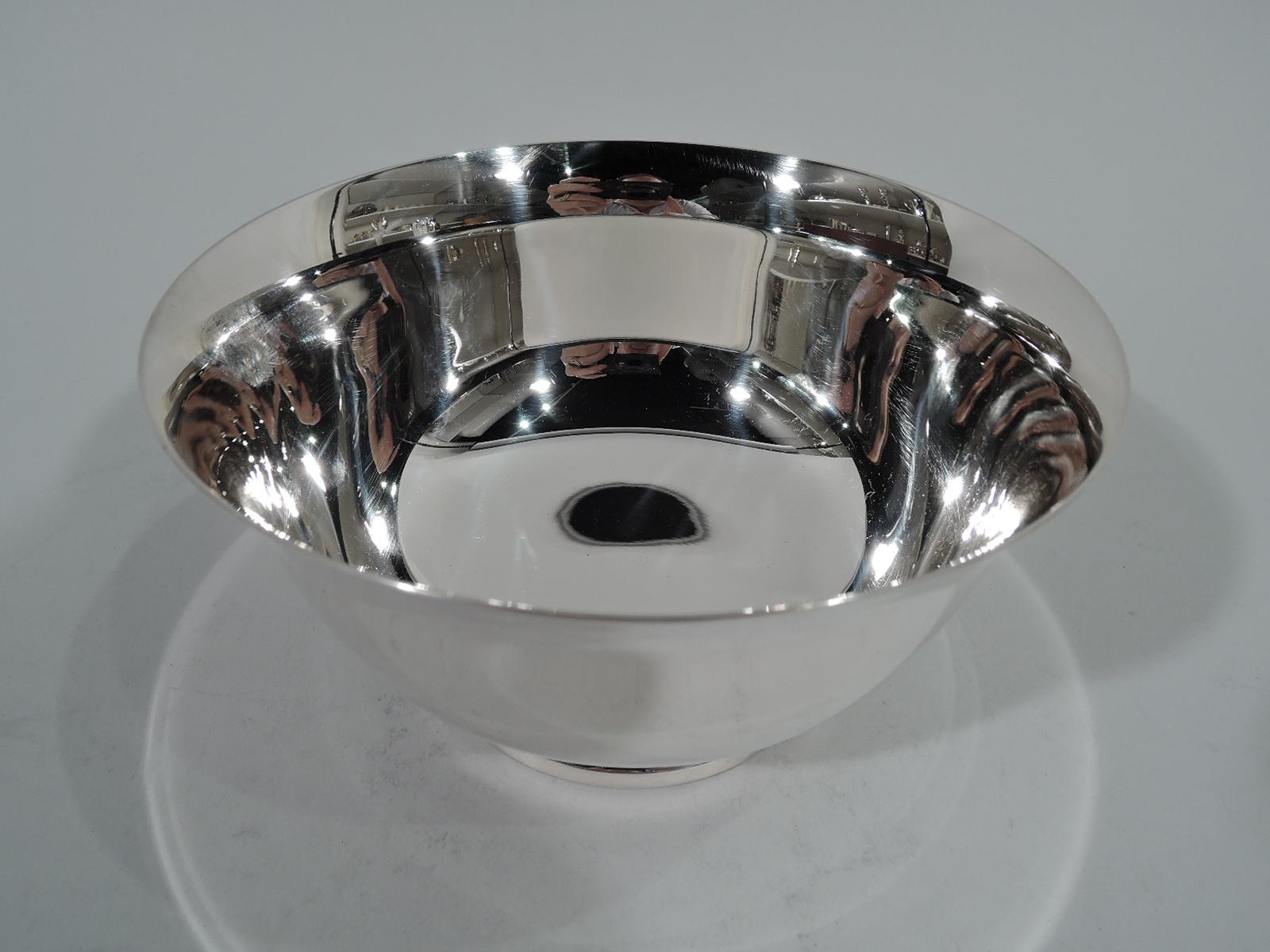 Colonial Revival sterling silver bowl. Made by Lunt in Greenfield, Mass. Traditional form with curved sides, flared rim, and stepped foot. Hallmark includes phrase “Paul Revere / Reproduction / circa / 1768” and no. 6R. Weight: 8.8 troy ounces.