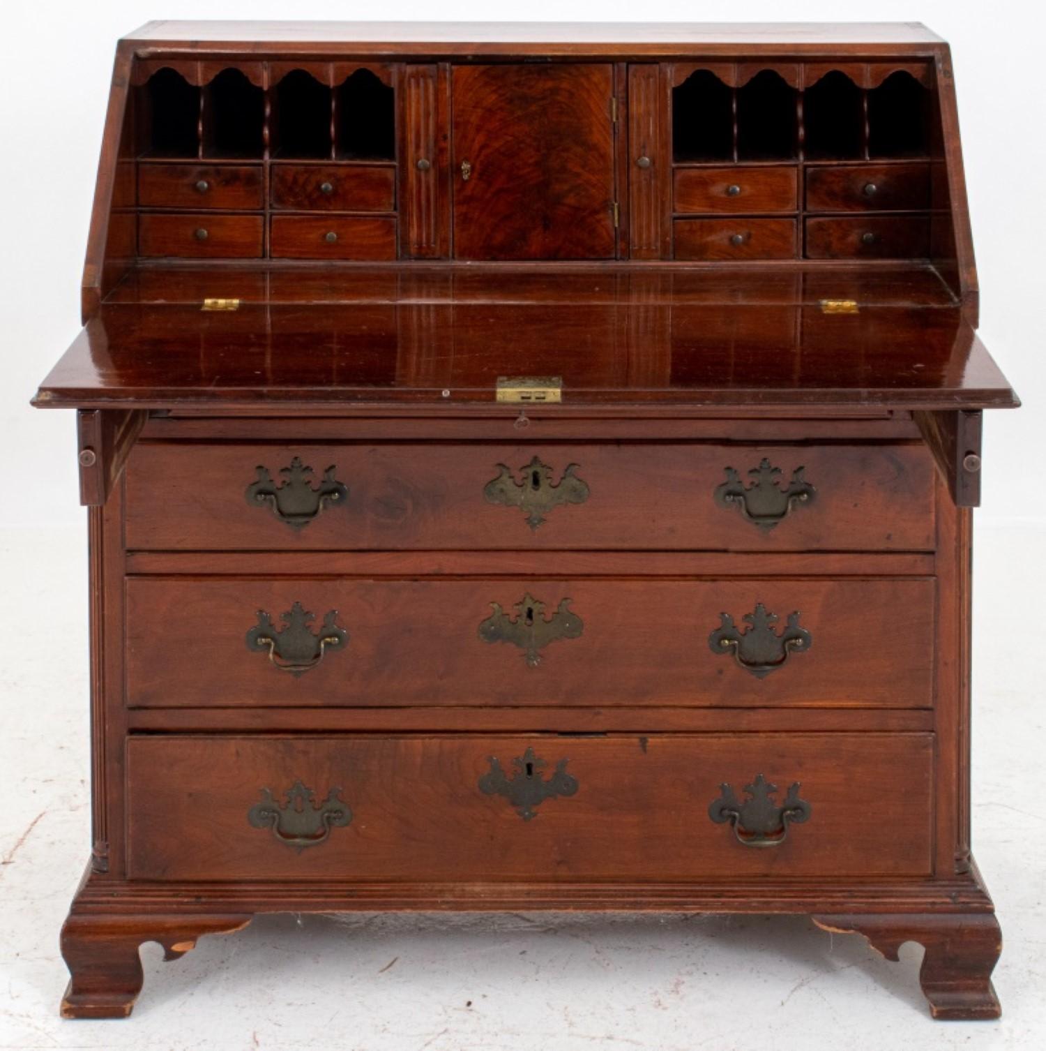 Colonial Revival 19th-century mahogany slant-front secretary desk/chest, rectangular with a slanted drop-front writing surface opening to reveal letter drawers and cubbies, above four drawers.

43 inches in height, 40 inches in width, and 22 inches