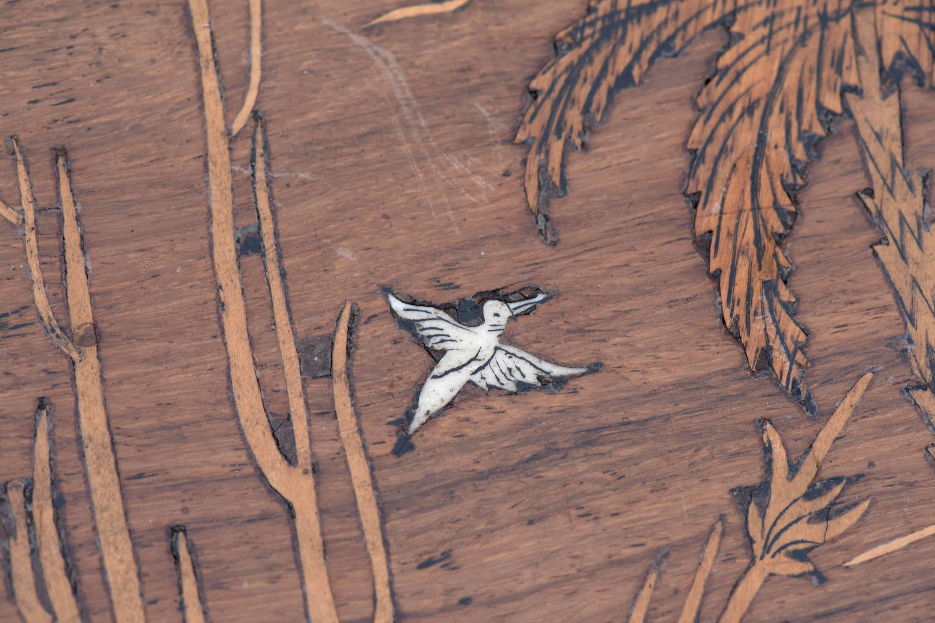 Colonial rosewood coffee table, the top with marquetry inlay depicting a wonderful scene of elephants in a landscape. Inlaid in bone.
Anglo-Indian, circa 1870.