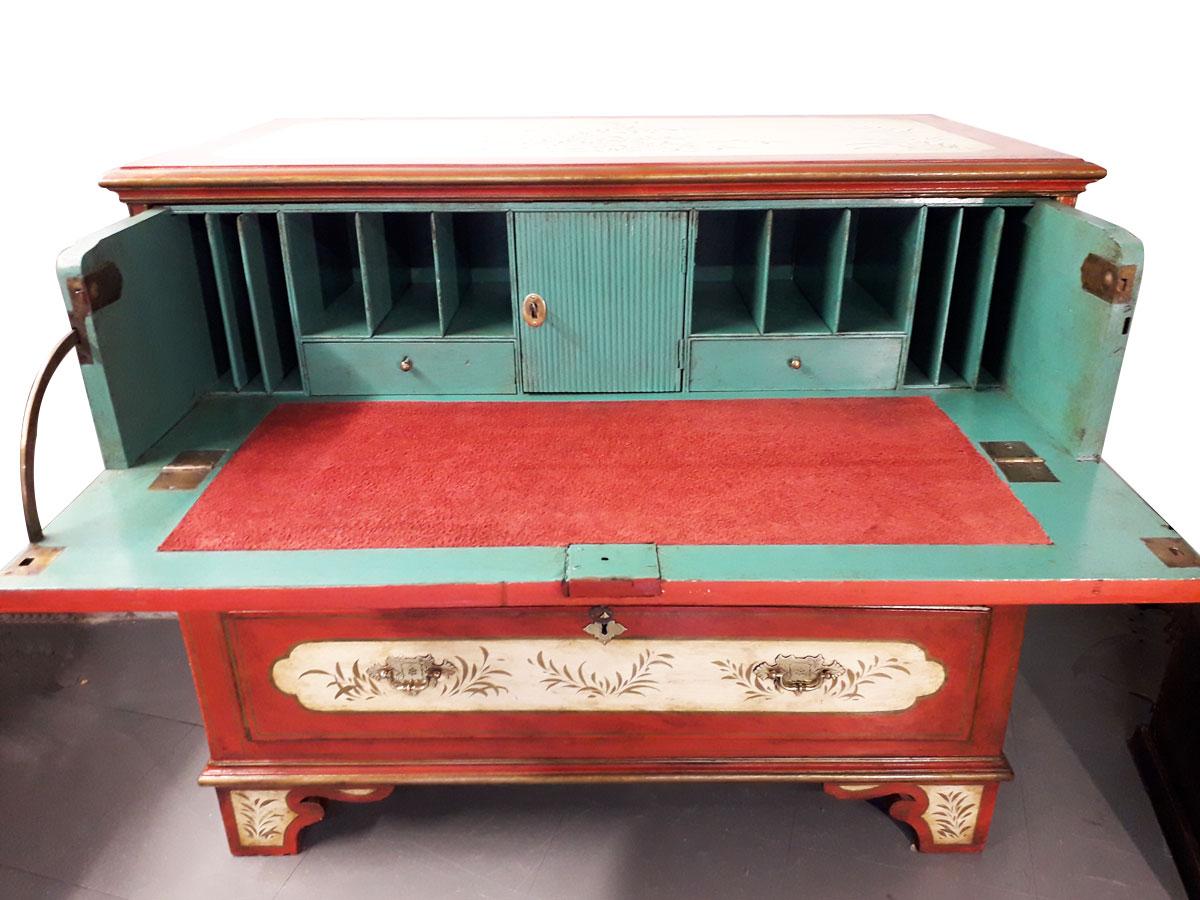 The decorated drawers and sides with gilded surrounds and foliage detail, its drop down front incorporating a contemporised suede secretaire and writing pad, this makes a great sock drawer if required for the bedroom. 
The piece has excellent