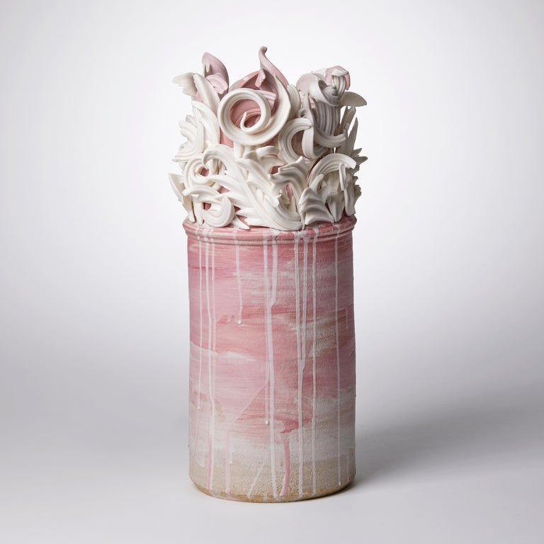 Colonnade I is a unique handmade coloured stoneware ceramic sculptural vase in dusky pink and white by the British artist Jo Taylor. The central form has been thrown on the potter's wheel and also hand-built, then adorned with architectural inspired