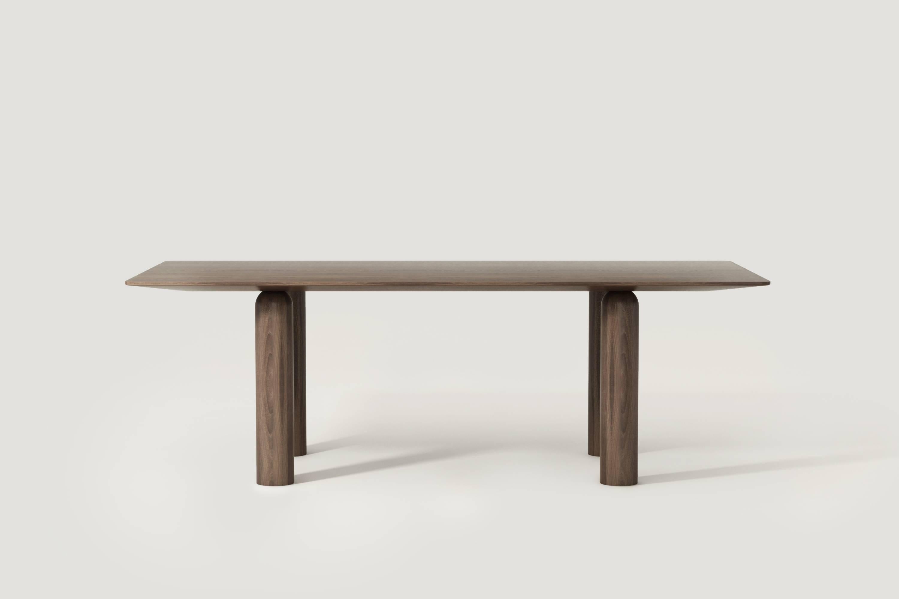 Colonne table connects different elements in a very invisible way to create an object.

Materials: 
Tabletop in solid walnut wood
Table feet in solid walnut wood.