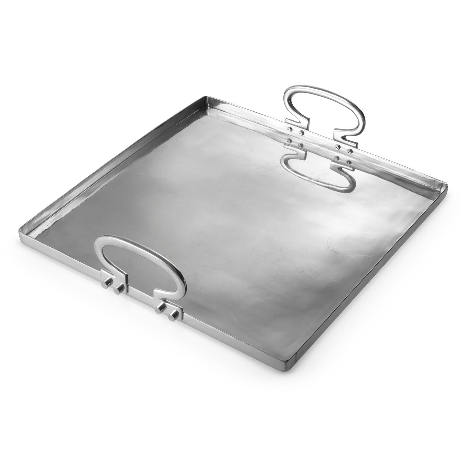Colony is a polished aluminium tray designed by Aldo Cibic. The square silhouette is Minimalist, but the rounded corners and the sinuous handles give to the object a warm and refined look. Colony is perfect on any occasion to serve drinks or food