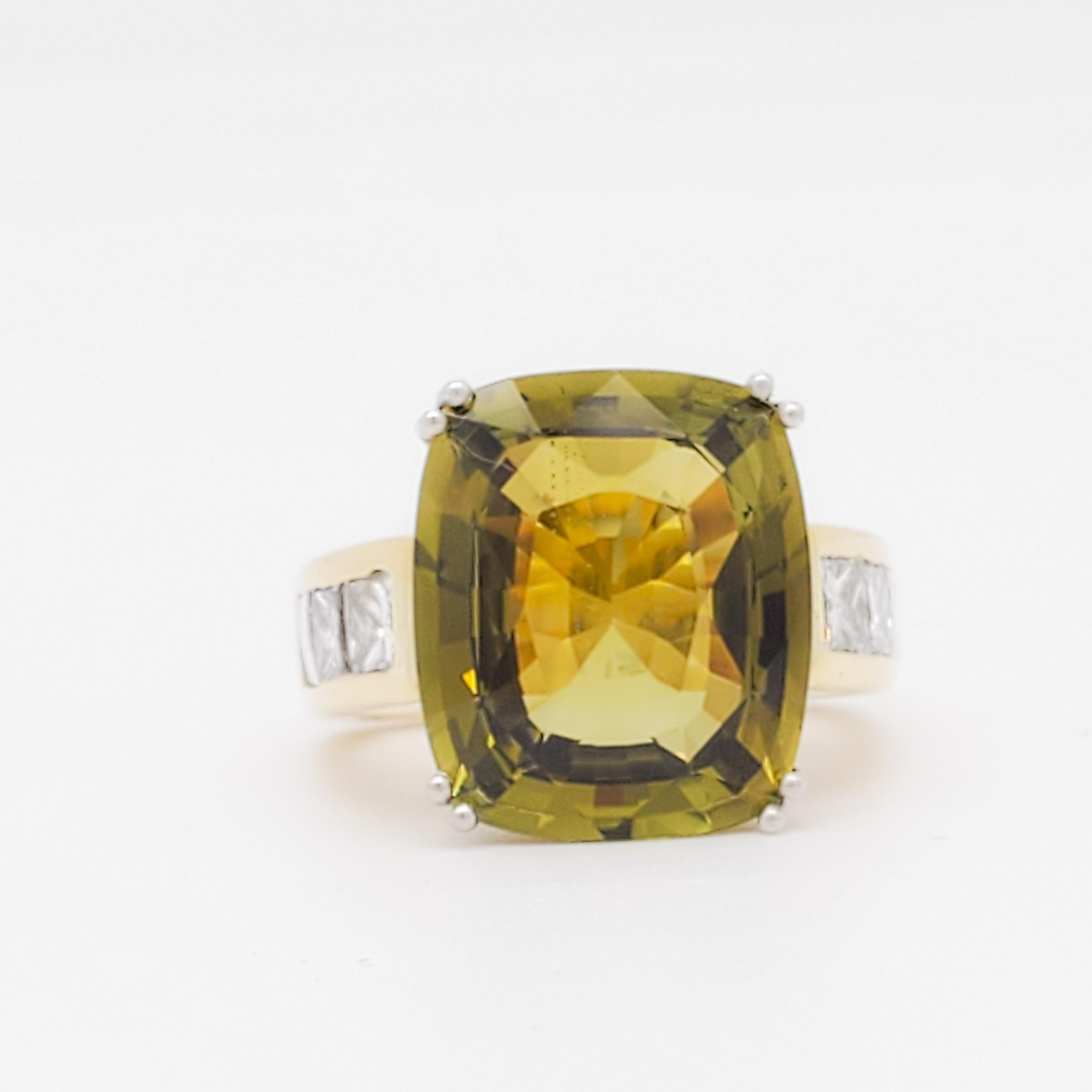 Gorgeous 10.80 ct. color change alexandrite cushion with 0.25 ct. good quality white diamond princess cuts.  Handmade in 18k yellow gold.  Ring size 4.5.