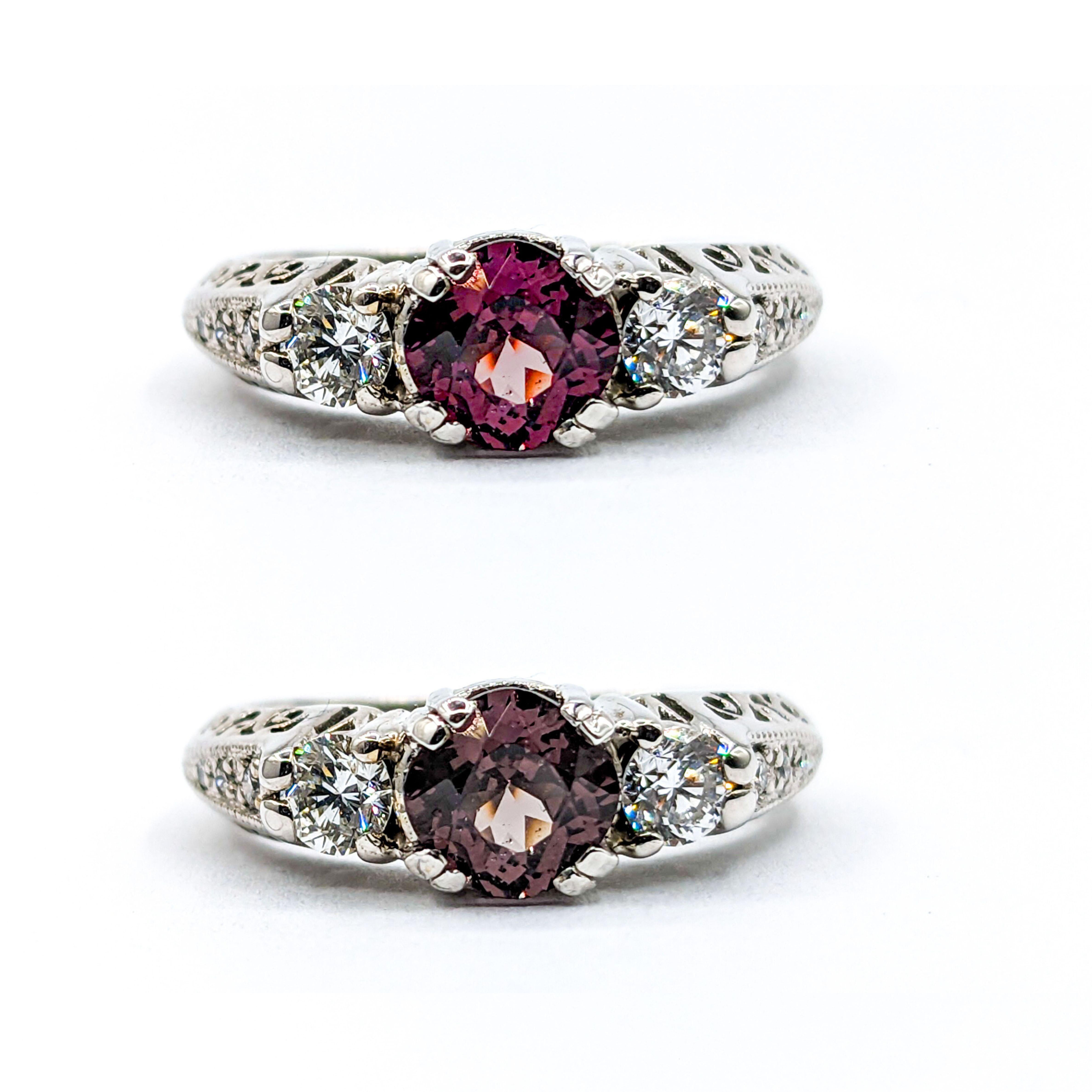 Color Change Garnet & Diamond Filigree Ring in White Gold

This exquisite Garnet ring is expertly crafted in 14-karat white gold with filigree details. The ring showcases a captivating 0.94-carat color-change garnet that fluctuates between a