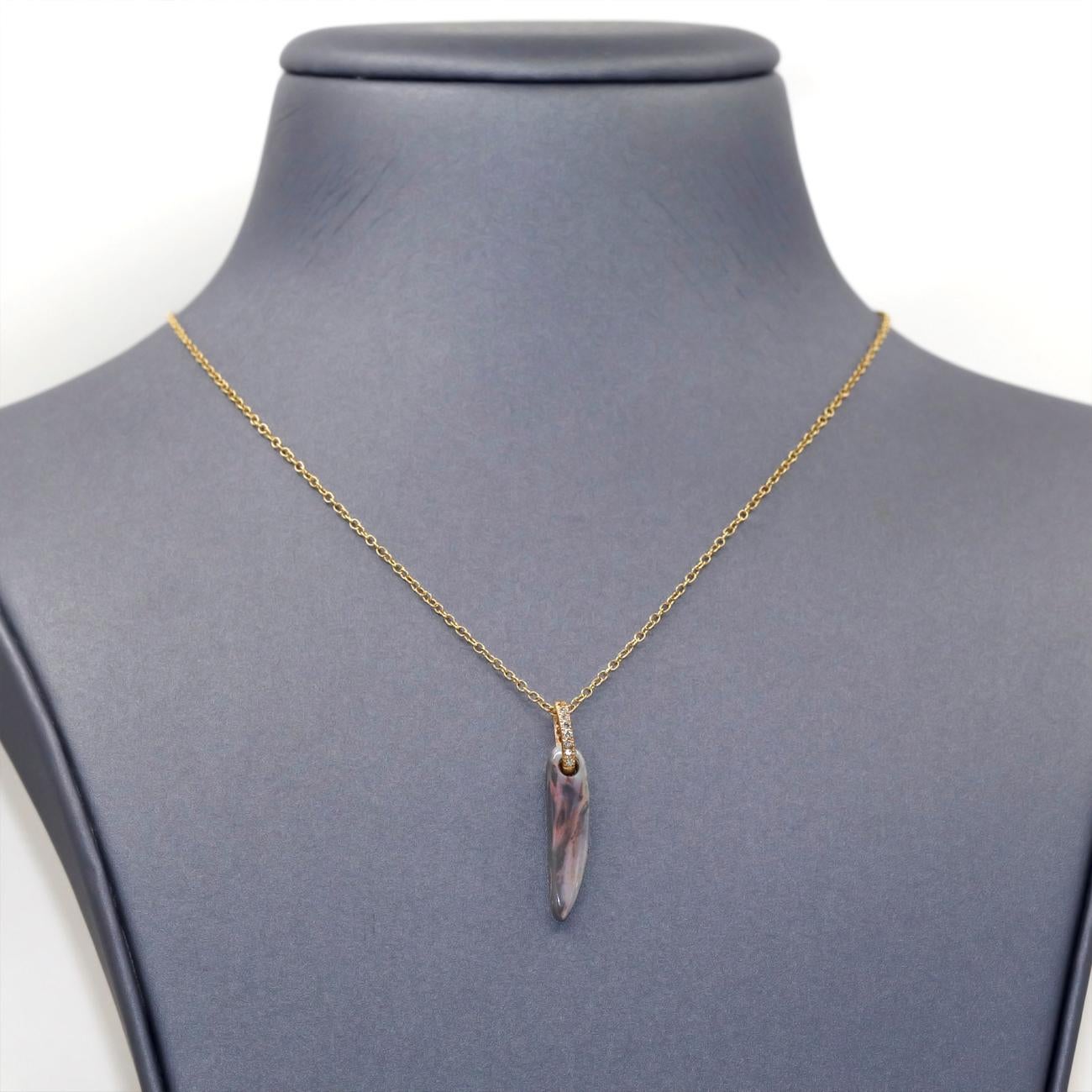 One of a Kind Floating Opal Necklace by jewelry designer Julie Romanenko featuring a beautiful elongated and curved natural Australian opal drop that features a unique change in colors, revealing flashes of red and pink from certain angles, with a