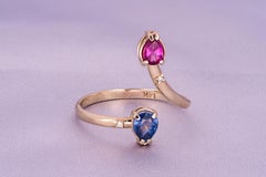 14k gold ring with red garnet, blue sapphire and diamonds