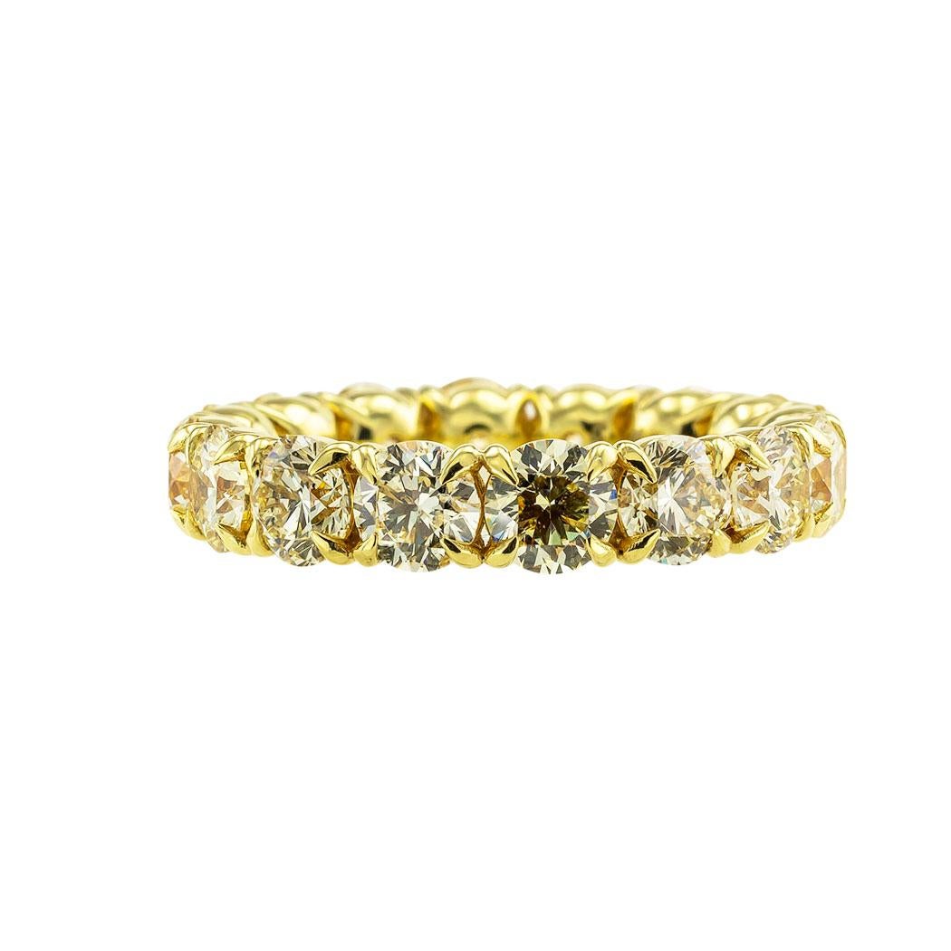 Lite yellow color diamonds and yellow gold estate eternity ring size 8.5.  *

ABOUT THIS ITEM:  #R-DJ37F. Scroll down for detailed specifications.  Continuously set with lite yellow color diamonds mounted in individual cup-shaped settings.  For