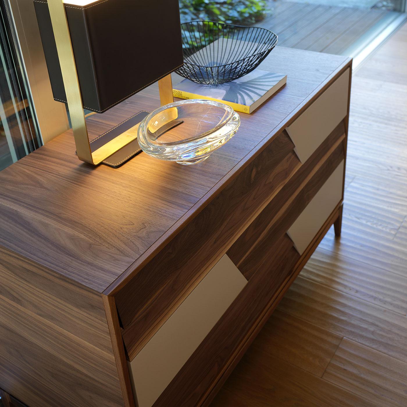 Colore Dresser by Dale Italia
Dimensions: D 55 x W 131 x H 80 cm.
Materials: Walnut.

The frame is made of walnut veneer blockboard with solid edging. Available in two different sizes and two finishes: natural and grey walnut. Prices may vary.
