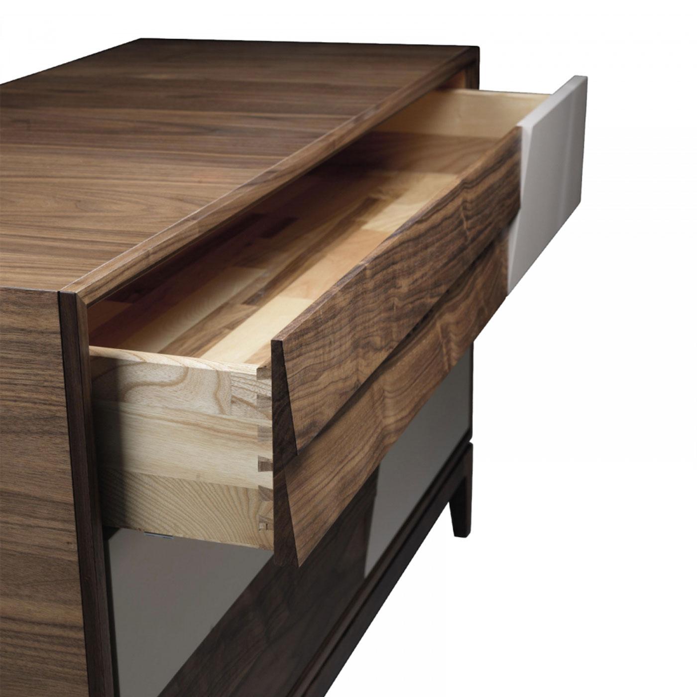 Made in Italy craftsmanship shines through the Colore solid wood dressers. With blockboard structure and slightly inclined drawers, they are made by expert hands from high-quality solid walnut with lacquered insert and acrylic finish. A modern yet