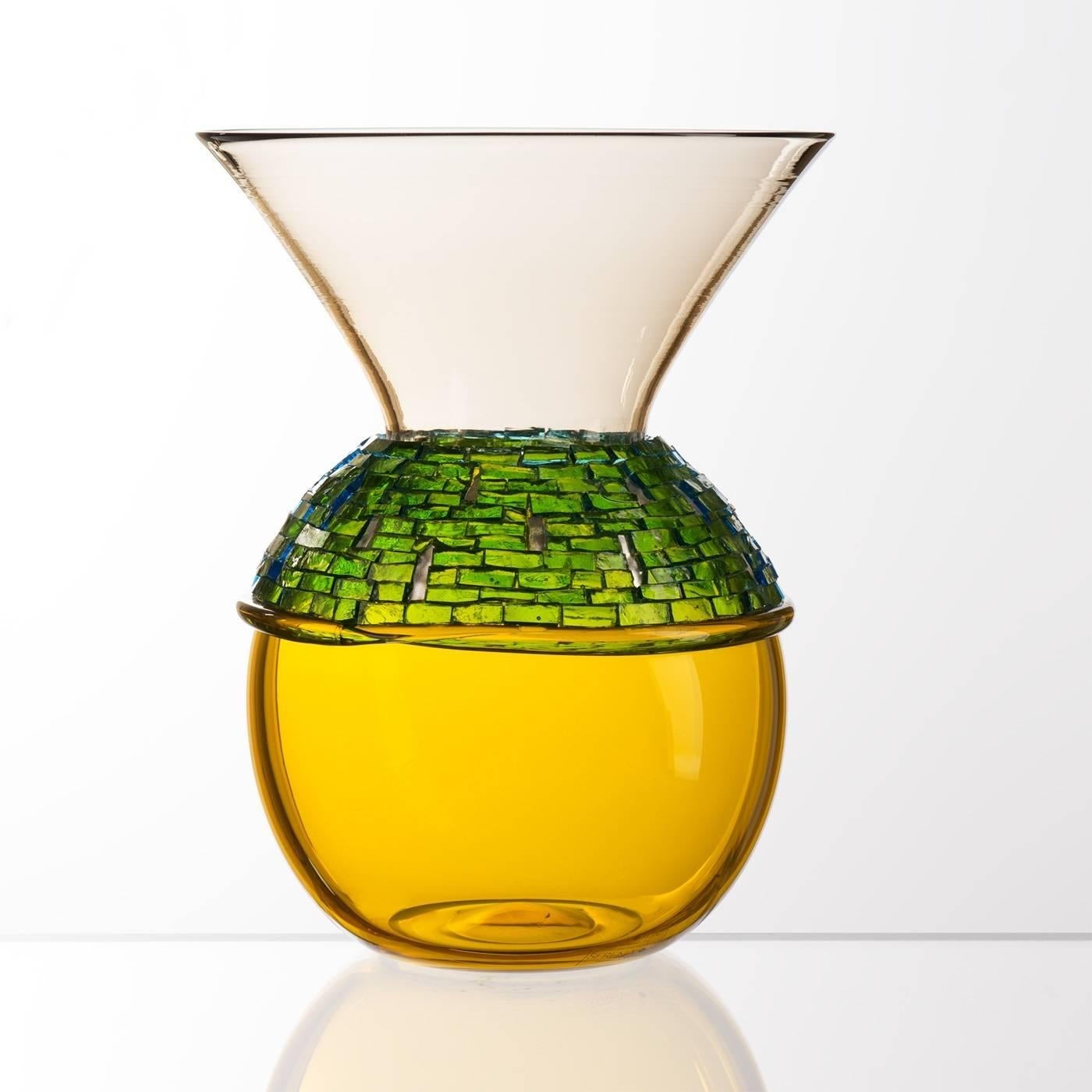 This vase is part of the design collection and was mouth-blown in Murano using the “incalmo” technique, consisting in joining two glass pieces of different colors, in this case yellow and tinted, while they're still hot to obtain a single blown
