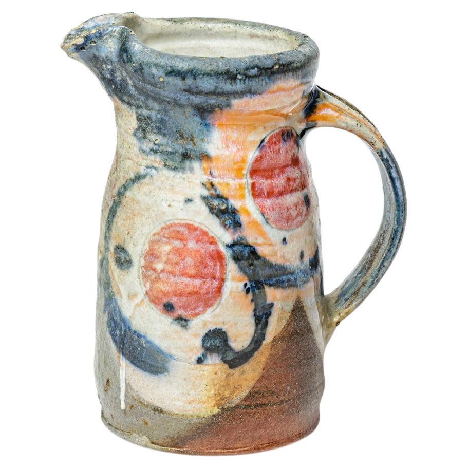 Colored blue and red stoneware ceramic pitcher circa 1990 signed Maya For Sale
