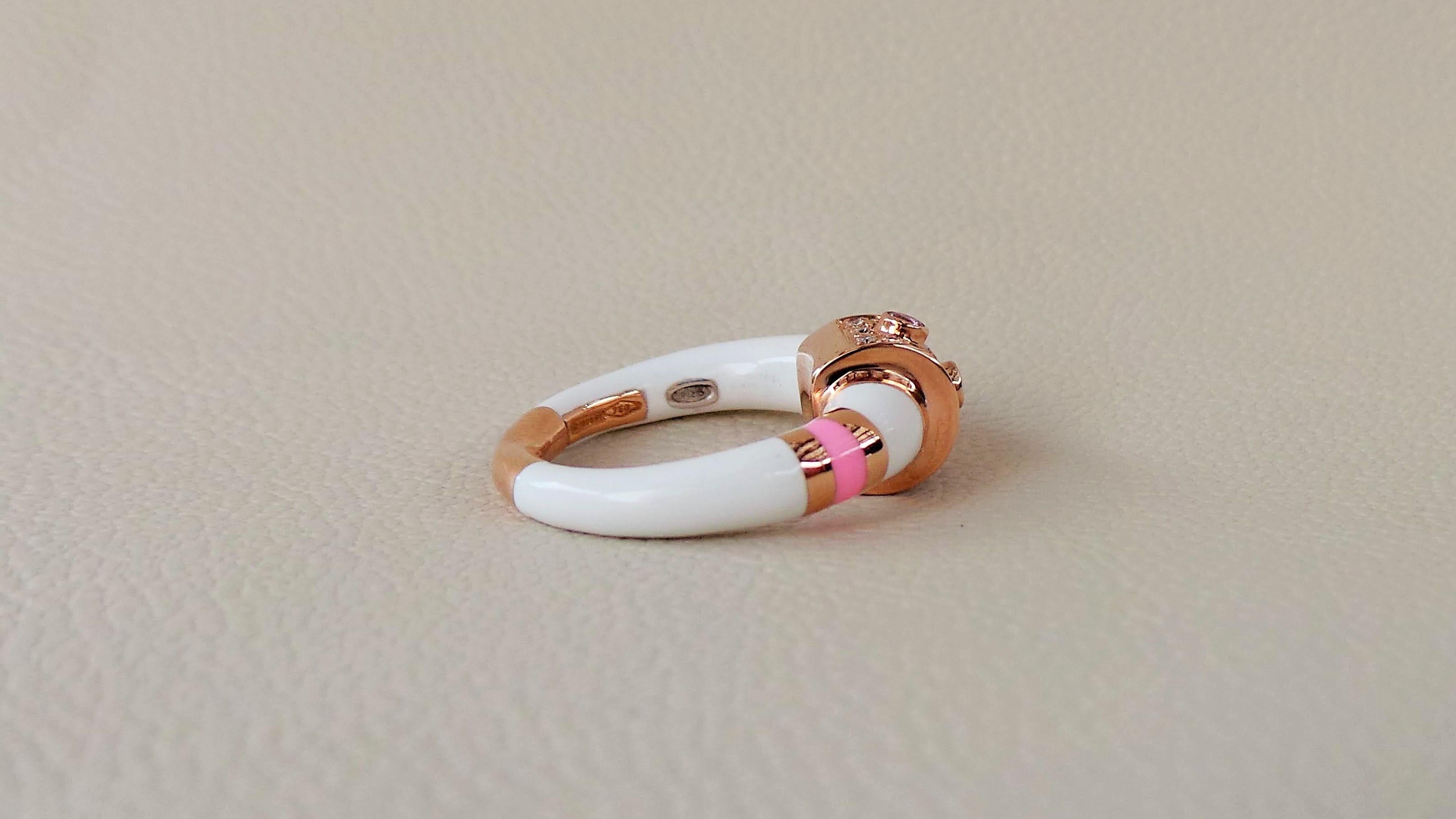 Andrea Macinai created this enamelled design and hand-set stones with 0.19 carat white diamonds cut brillant and 0.10 carats pink saphhires. 
Rose Gold fused with silver inside to better bind the enamel and make it lighter.
This beautiful enamelled