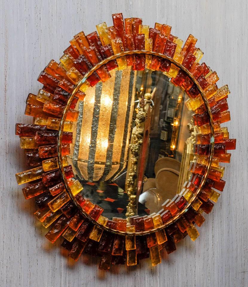 Mirror framed with colored glass paste.
