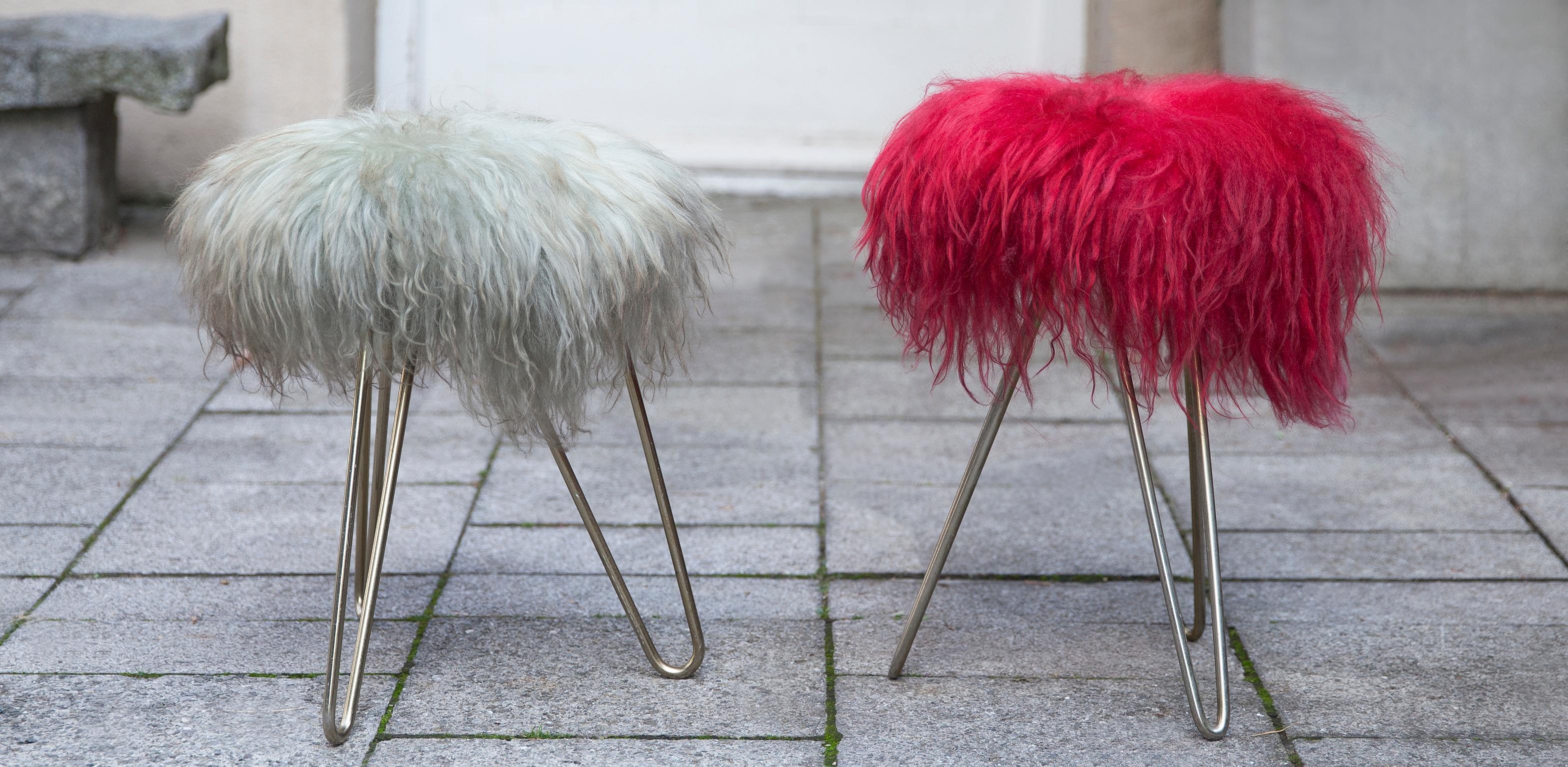 Two fantastic lambs wool stools on a triangle brass base from Germany, 1950.