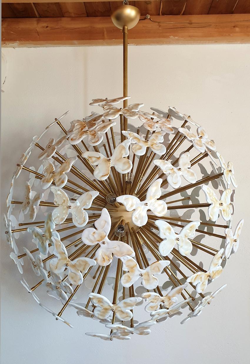 Very large Mid-Century Modern white and gold butterflies Murano glass sputnik chandelier, with brass stems, and painted center ball frame.
