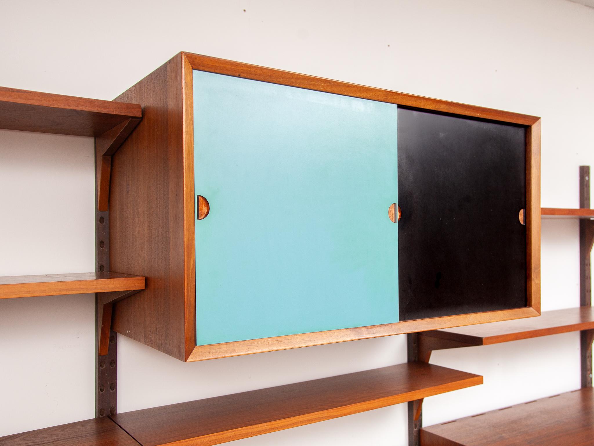 Hand-Crafted Colored Yellow, Blue and Teak Modular Wall Bookcase by Hansen & Guldborg Denmark For Sale