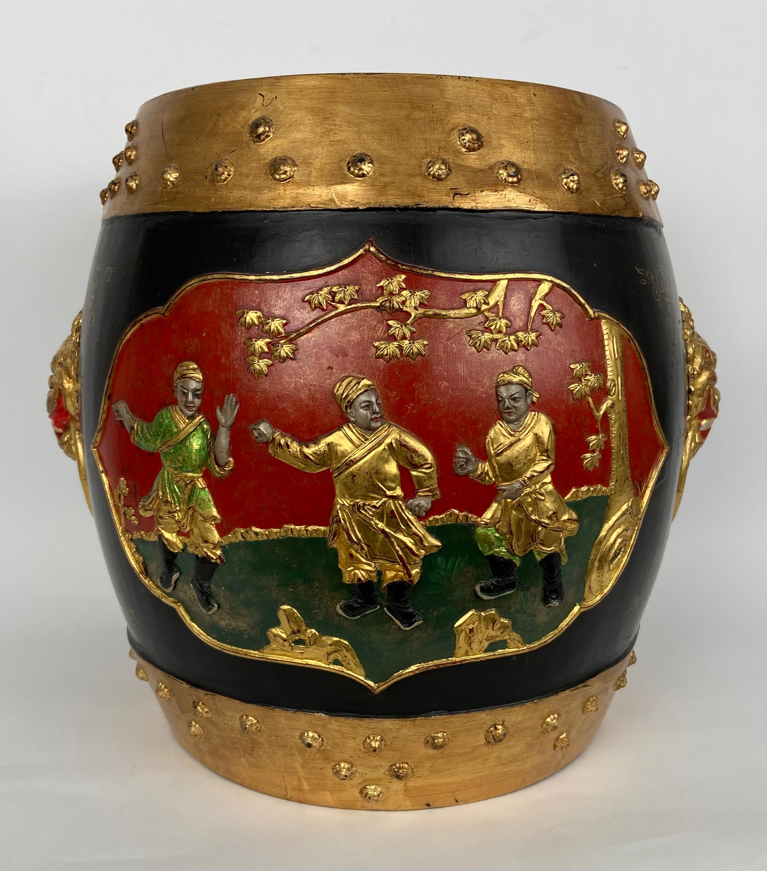 Colorfoul Chinese wooden jar with lid. 
Decorated with wood-carved figures in relief and 2 lion heads.