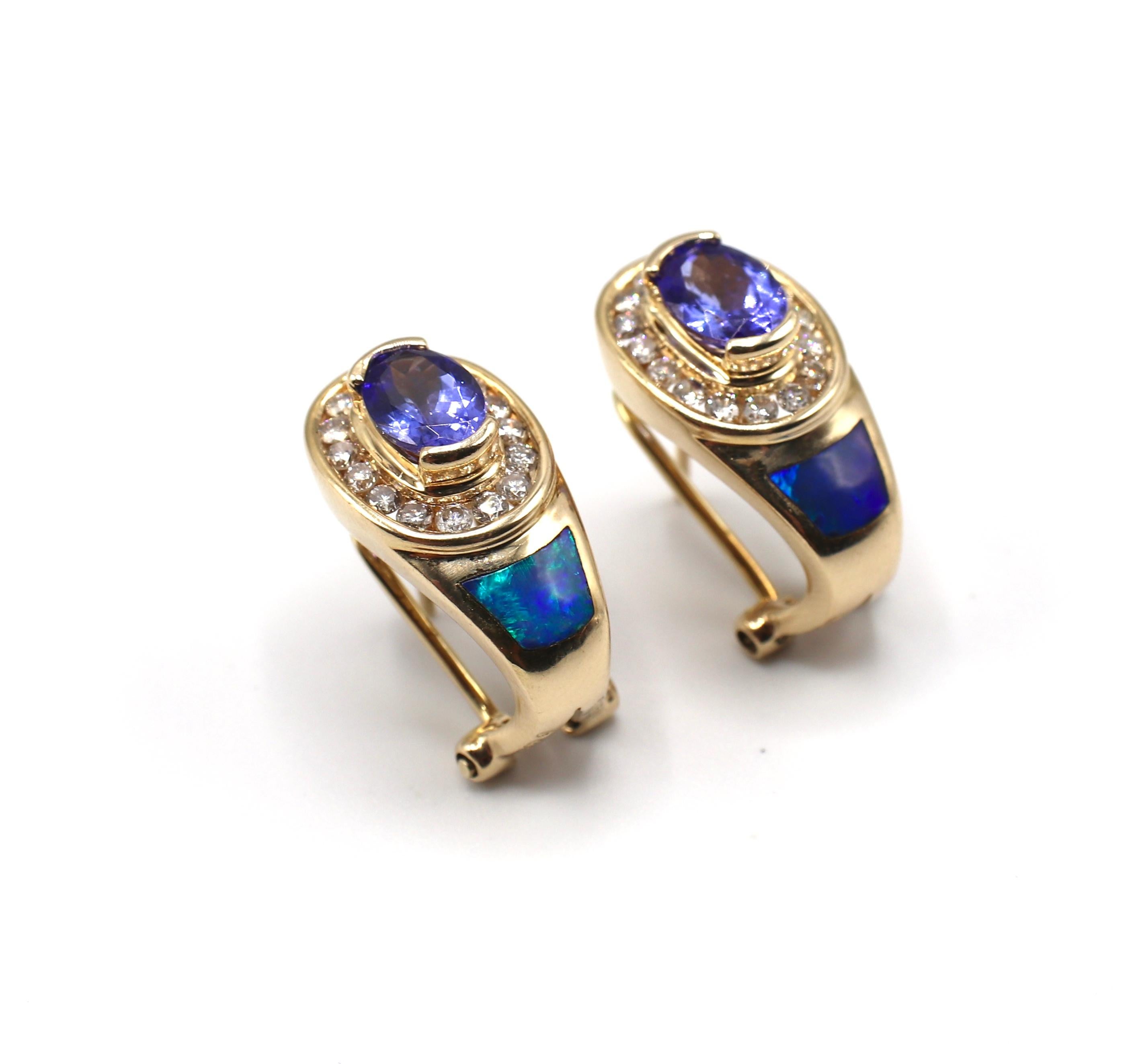 Vintage Colorful 14K Yellow Gold Tanzanite, Opal & Diamond Earrings 

Metal: 14k yellow gold, marked 14K
Weight: 7.75 grams
Diamonds: 32 round brilliant cut diamonds, approx. .34 CTW G-H SI
Tanzanite: 2 oval tanzanites, approx. .75 each, 1.50