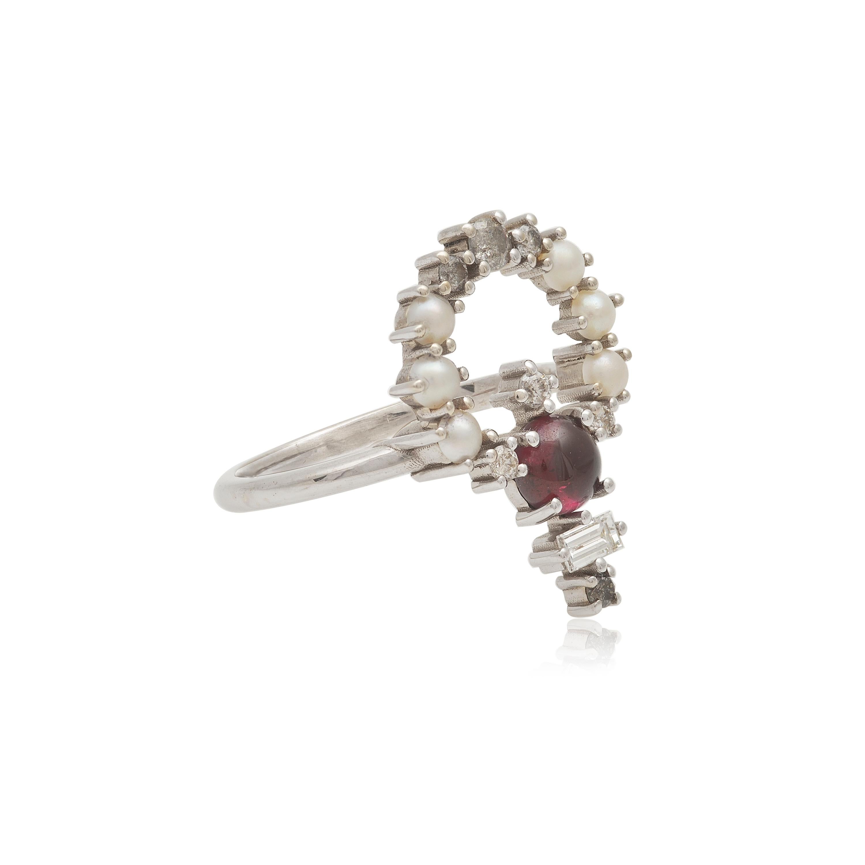 Designer: Alexia Gryllaki
Dimensions: L20x20mm
Ring Size UK N 1/2, US 7 1/2
Weight: approximately 3.4g  
Barcode: OFS043

Multi-stone ring in 18 karat white gold with a round cabochon rhodolite garnet approx. 0.68cts, round cabochon cultured pearls
