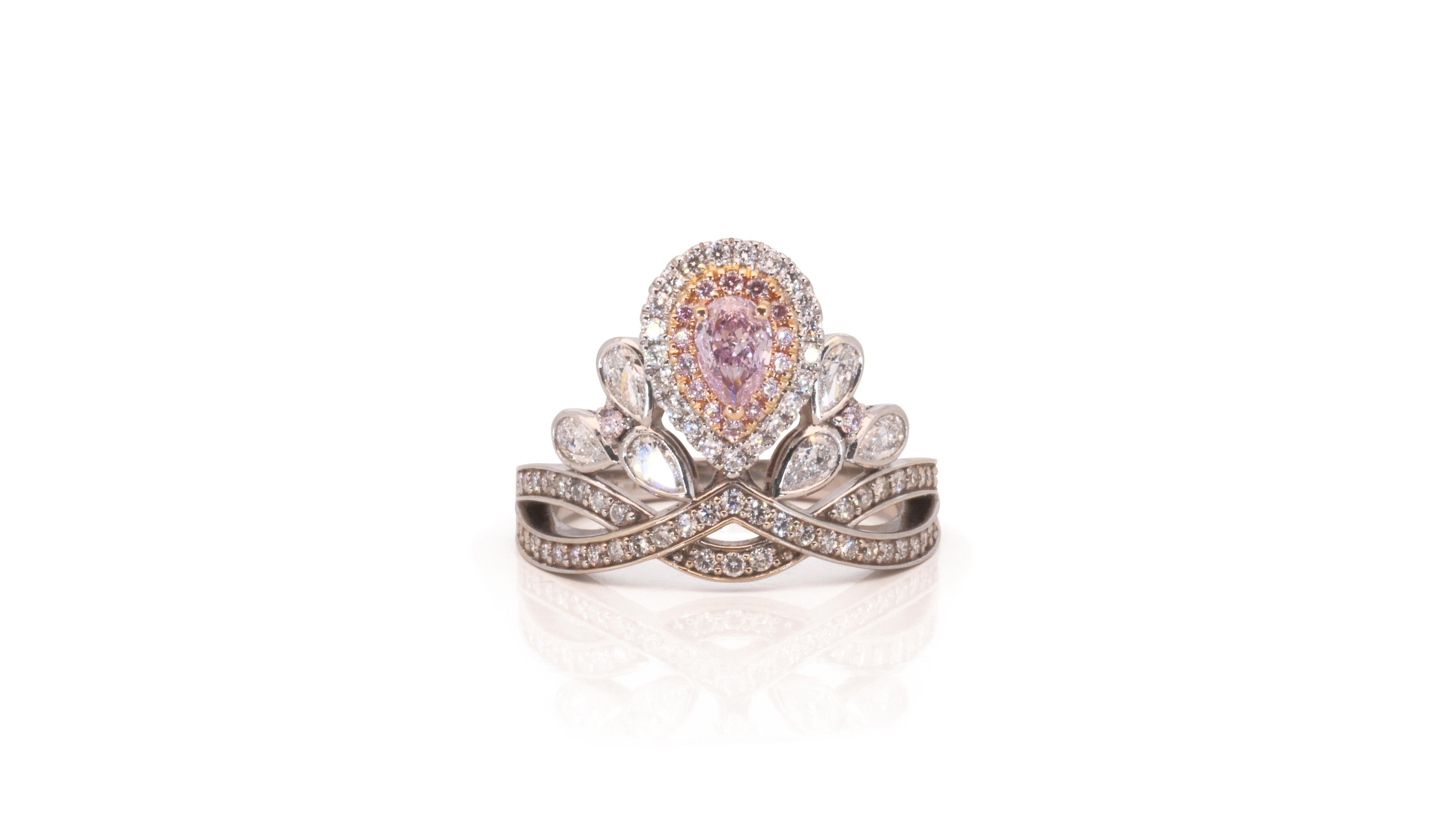 A superb halo crown ring with a dazzling 0.29 carat pear shape natural diamond. It has 0.89 carat of side diamonds which add more to its elegance. The jewelry is made of 18k white gold with a high quality polish. It comes with a fancy jewelry