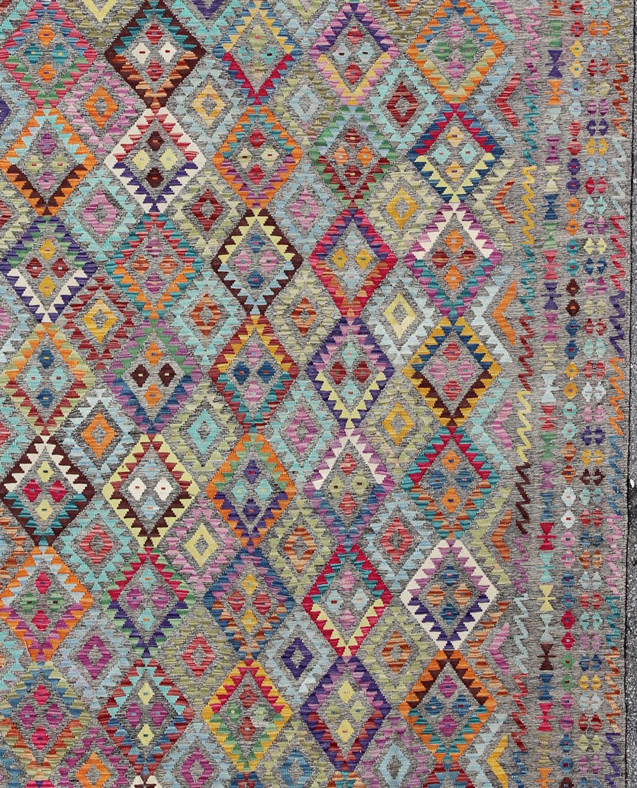 Colorful Kilim Rug/ ABT-8121463, 21st Century Afghan Kilim Rug-   10'5×12'8. 
 Hand Woven Kilim Keivan Woven Arts, This hand-woven Afghan Kilim rug features a beautiful geometric design in a rainbow assortment of colors, including red, blue, orange,