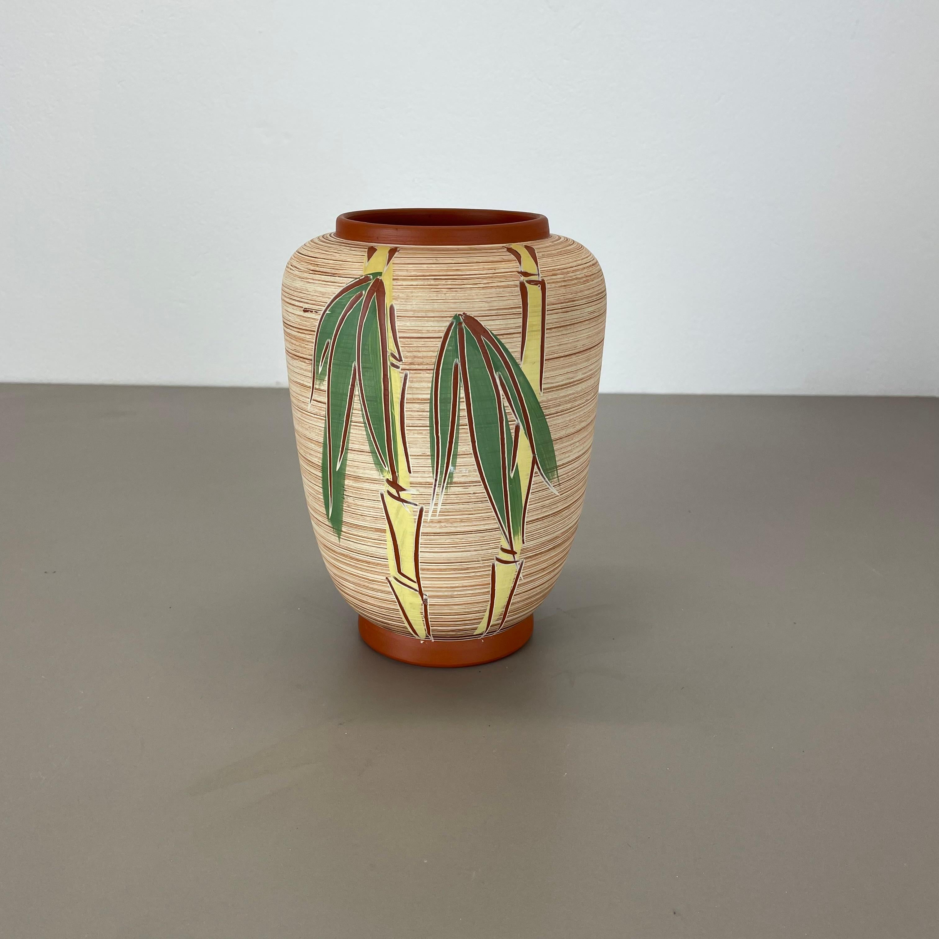 Article:

Pottery ceramic vase


Producer:

EIWA Ceramic, Germany



Decade:

1950s



Description:

Original vintage 1950s pottery ceramic vase made in Germany. High quality German production with a nice abstract BAMBOO painting. The vase was