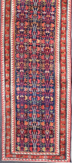 Colorful Antique Kazak Long Runner with Multi-Geometric Motifs On A Navy Field