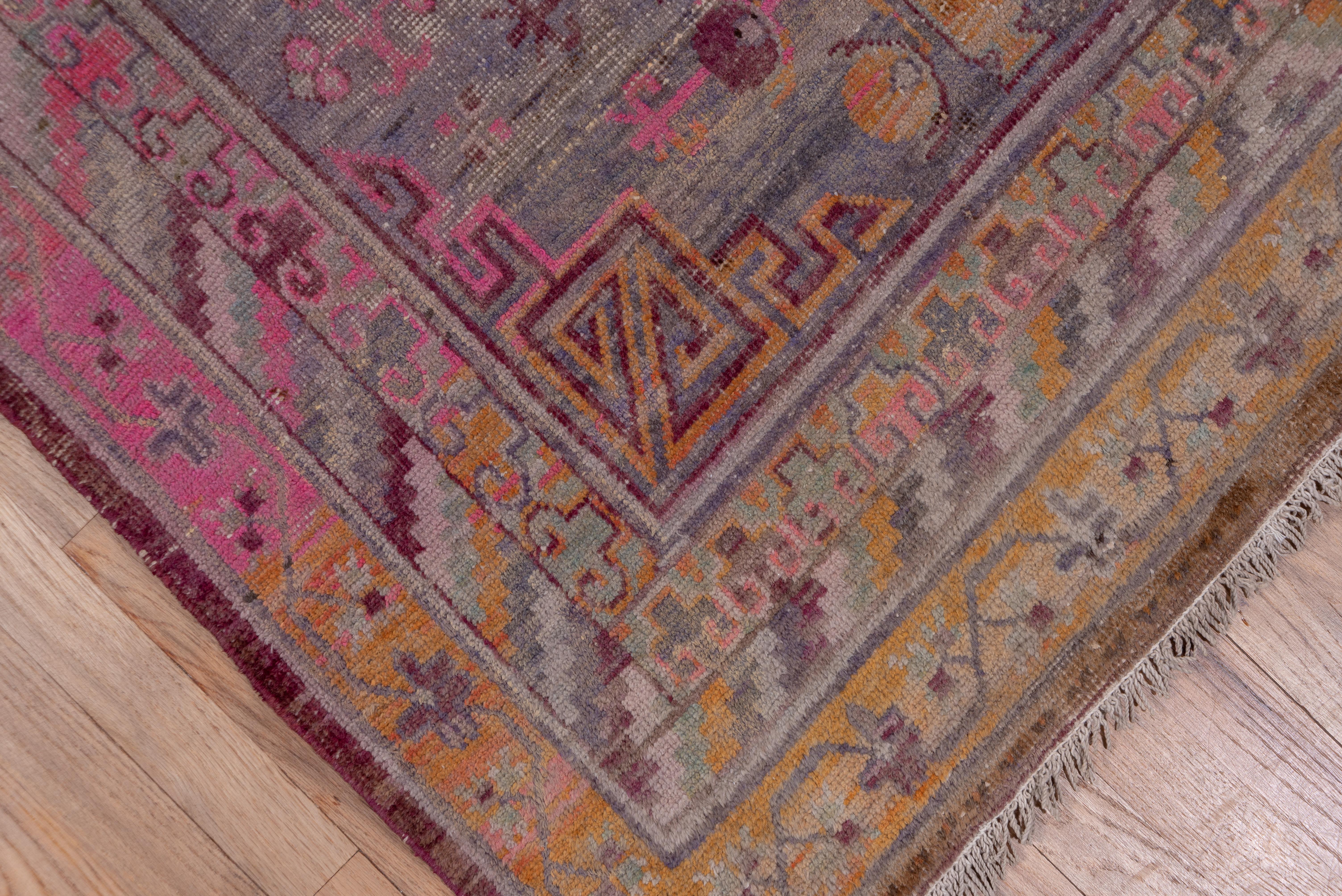 East Turkestani Colorful Antique Khotan Rug, Purple Pink and Orange Tones For Sale