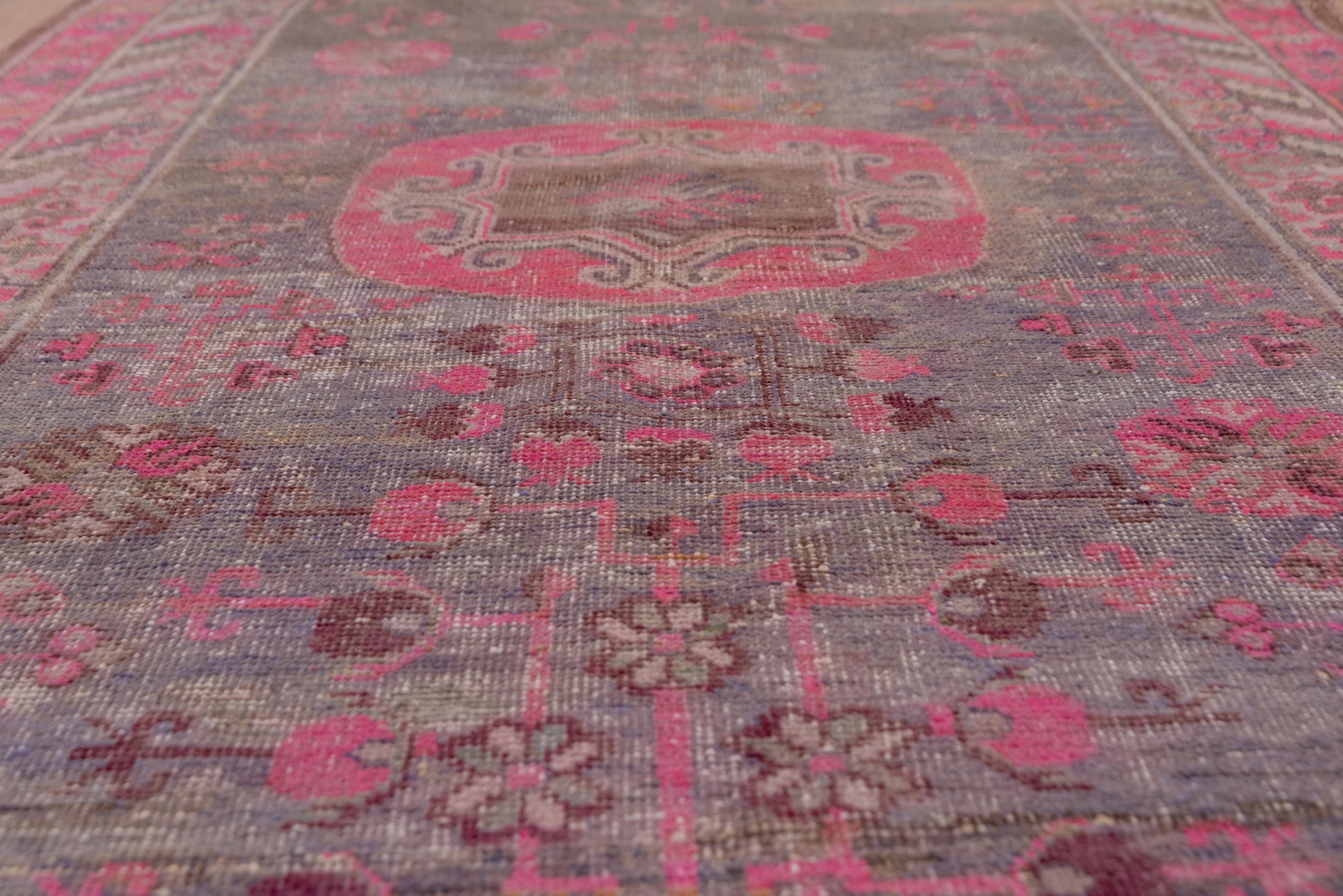 Early 20th Century Colorful Antique Khotan Rug, Purple Pink and Orange Tones For Sale