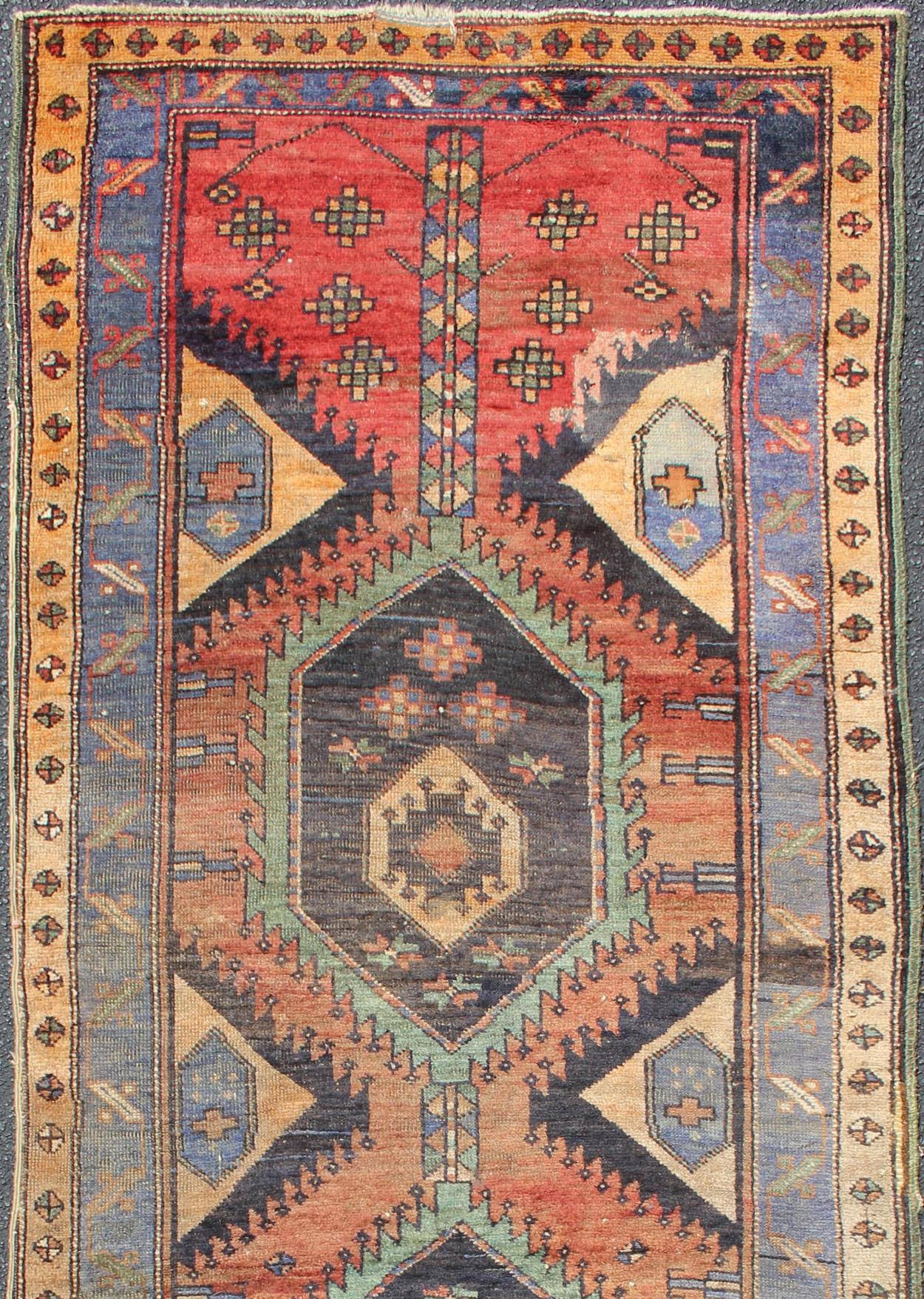 Colorful vintage Persian Hamadan runner with tribal Motifs, Vertical Medallion Design, rug DSP-0505-20, country of origin / type: Iran / Hamadan, circa 1930.

This vintage Persian Hamadan runner (circa mid-20th century) features a unique blend of