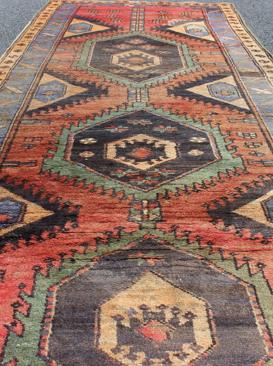 20th Century Colorful Antique N.W Persian Hamadan Runner with Tribal Medallion Design For Sale