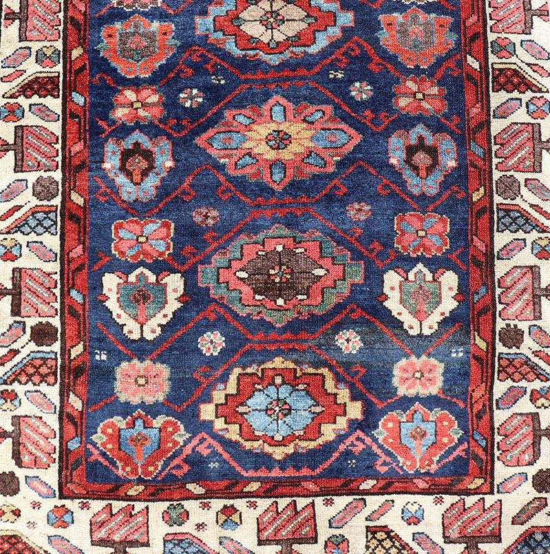 Colorful Antique N.W. Persian Runner with Sub-Geometric All-Over Floral Motifs. Keivan Woven Arts / rug EMB-22209-15089, country of origin / type: Iran / N.W. Persian, circa 1920
Measures: 3'2 x 13'3 
This Northwest Persian runner features a deep