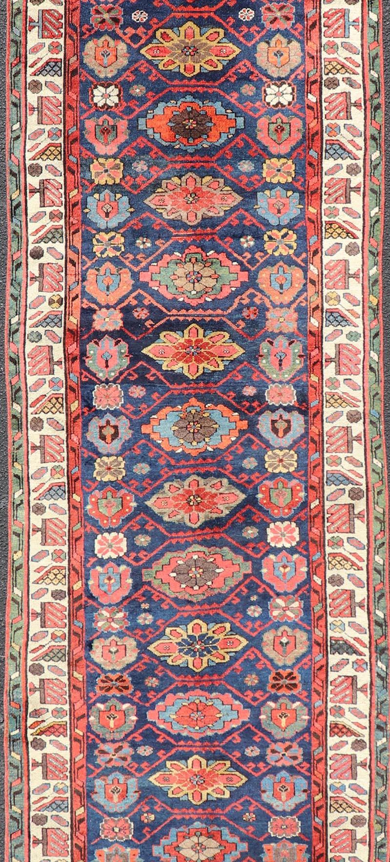 Hand-Knotted Colorful Antique N.W. Persian Runner with Sub-Geometric All-Over Floral Motifs  For Sale