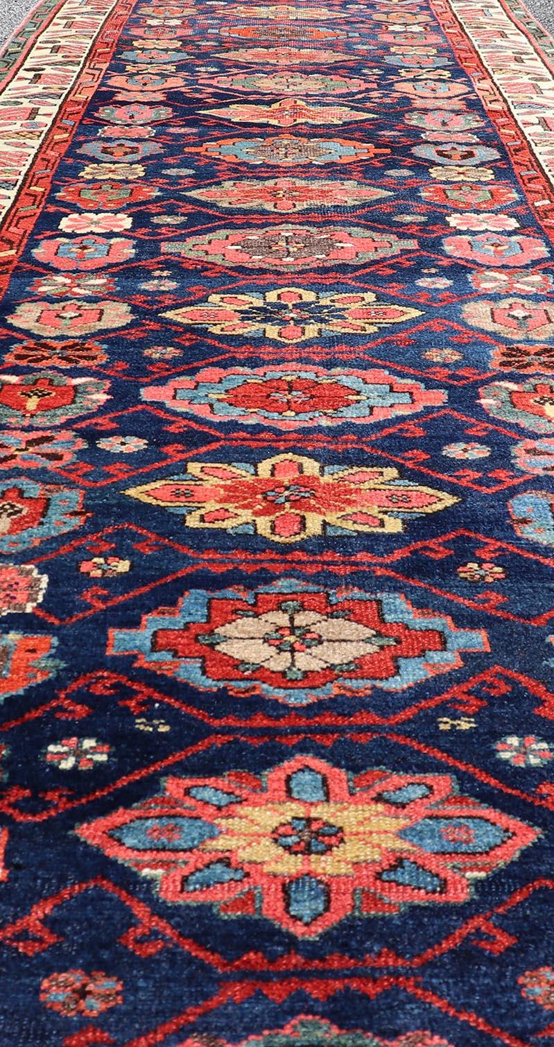 Wool Colorful Antique N.W. Persian Runner with Sub-Geometric All-Over Floral Motifs  For Sale